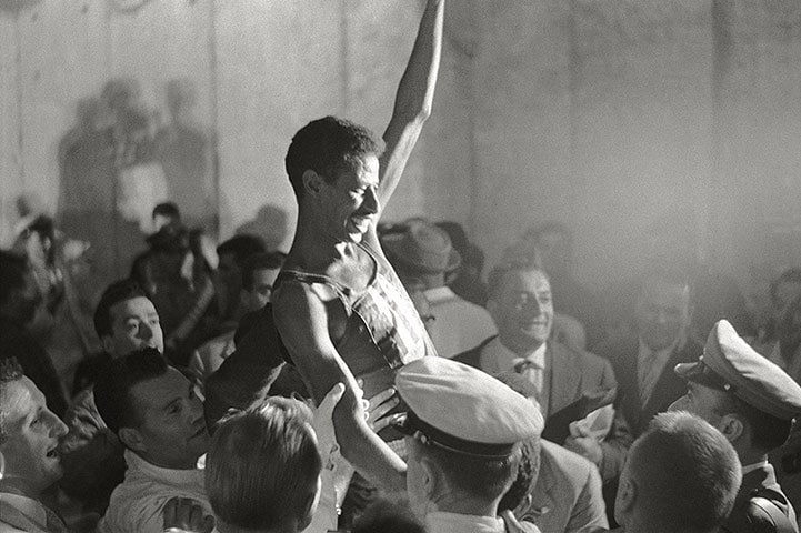 Abebe Bikila is hoisted in celebrations in Rome