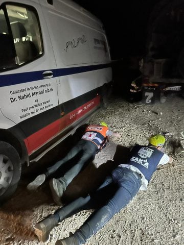 Zaka and Ezer MiZion activists hiding during the evacuation of the fallen