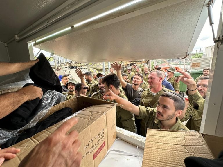 Soldiers come to pick up the packages.