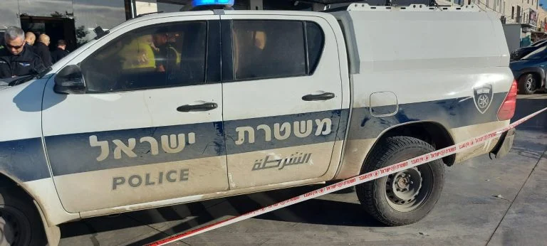 The police at the scene of the murder in Rahat