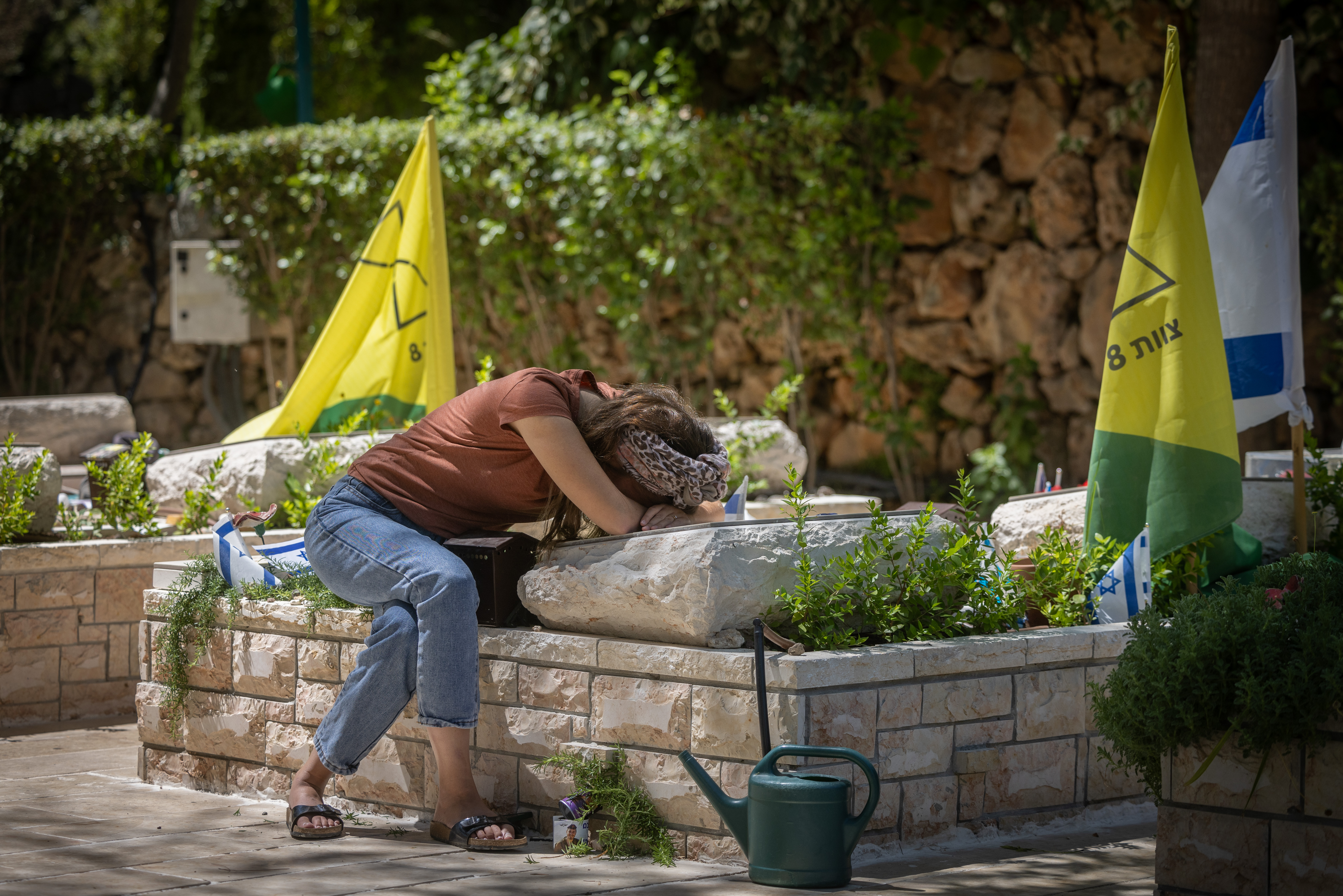 Anat Meir near her husband Sayeret Matkal soldier David Meir's grave , w