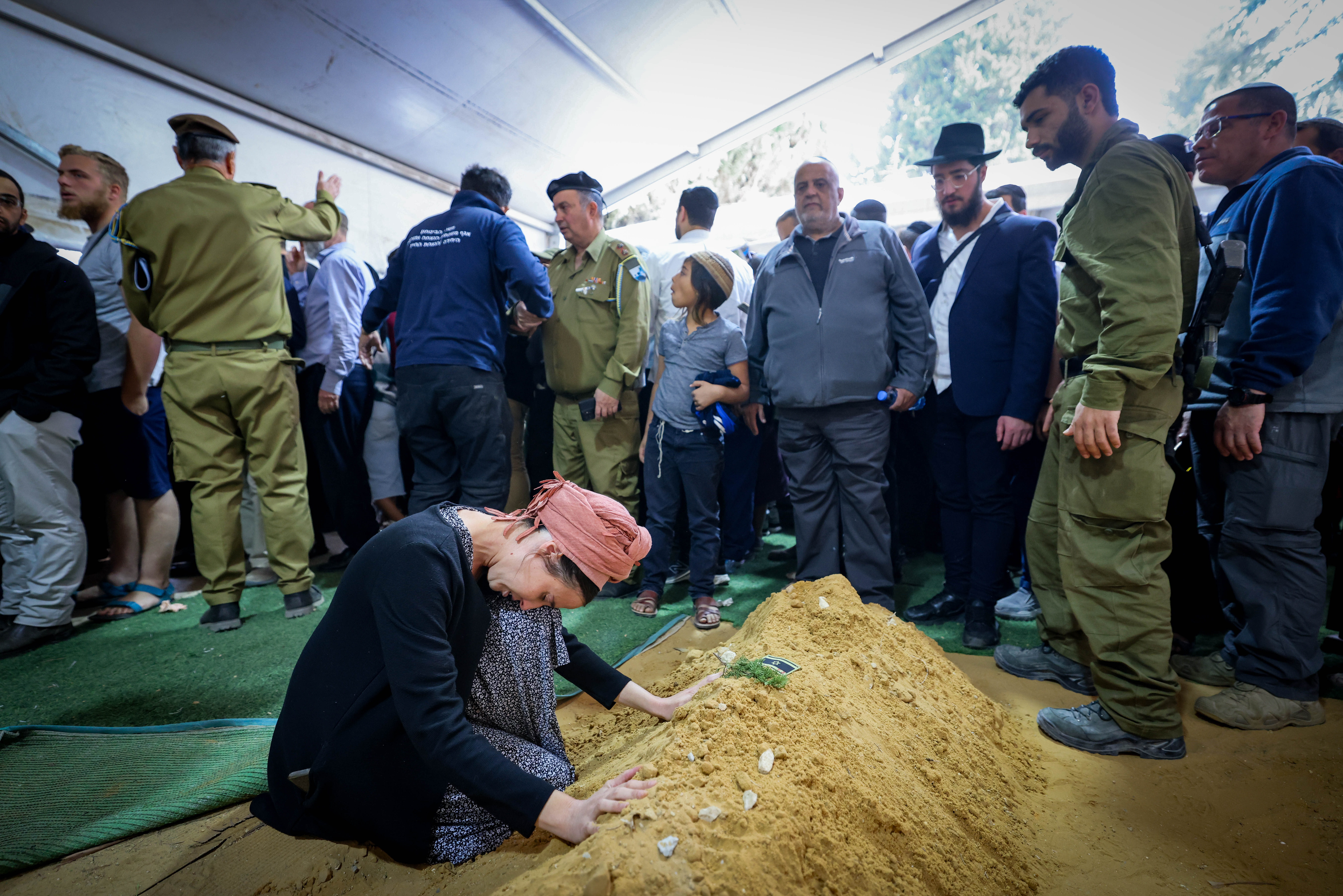 Family and friends of Israeli soldier Master sergeant (res.) Shlomo Aviad Nayman, attend his funeral at Mount Herzl Military Cemetery in Jerusalem on October 25, 2024. He fell in battle in southern Lebanon.