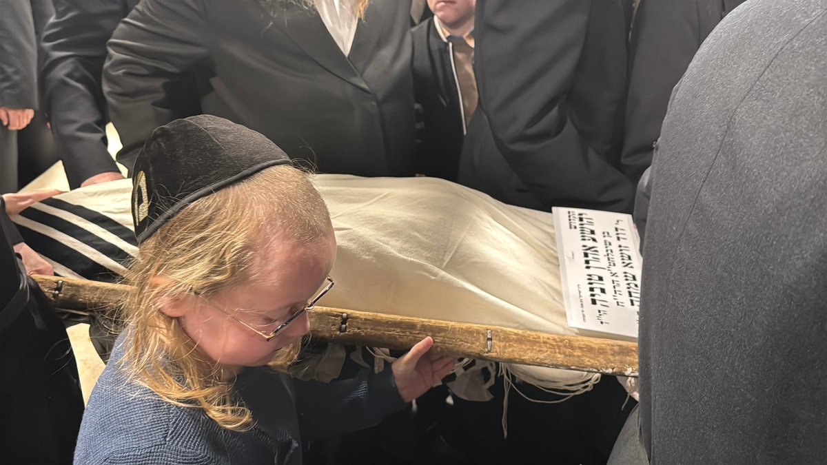 Little brother bids farewell to his slain brother