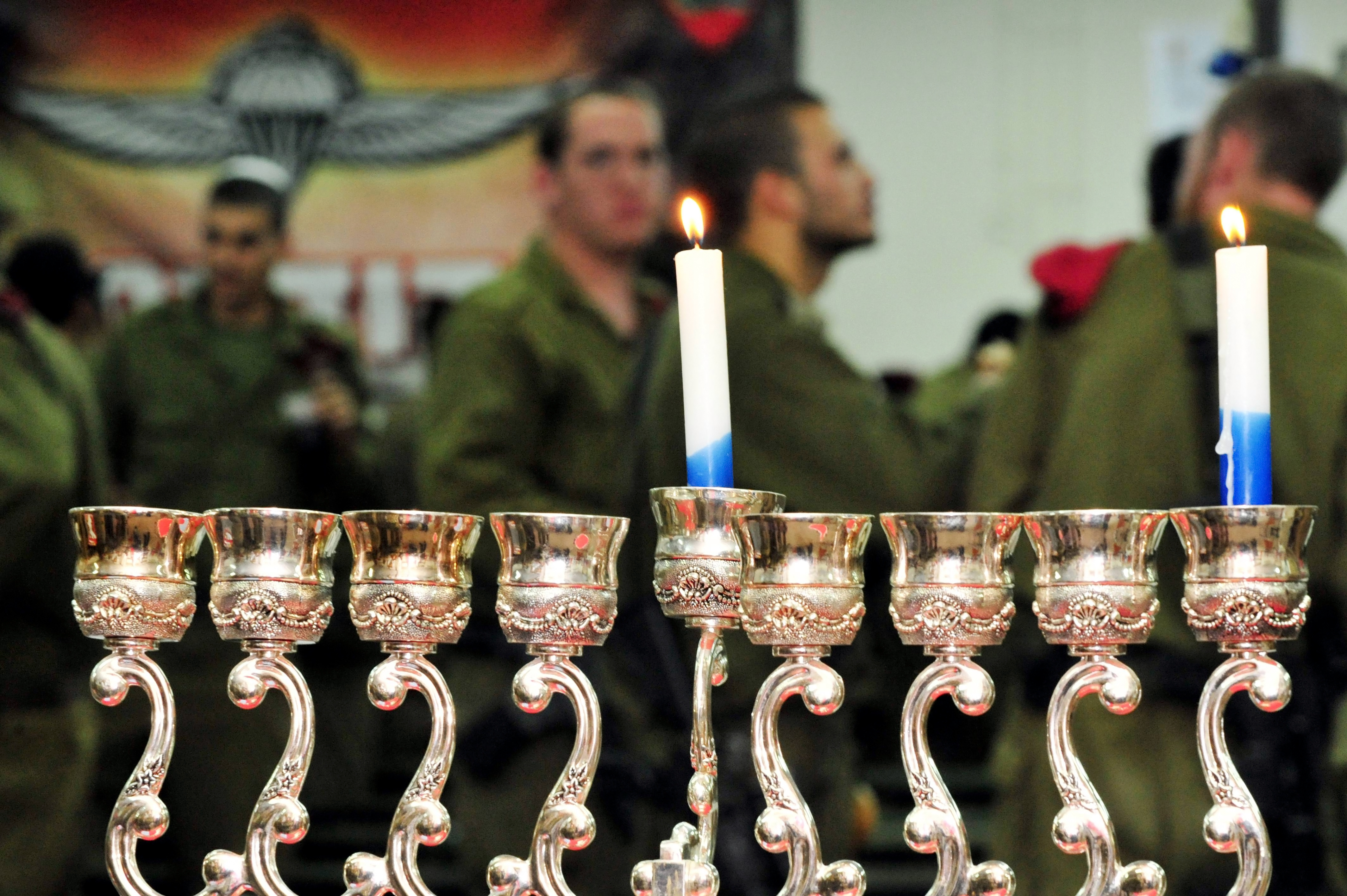 Soldier and his savior doctor reunite to light first Hannukah candle
