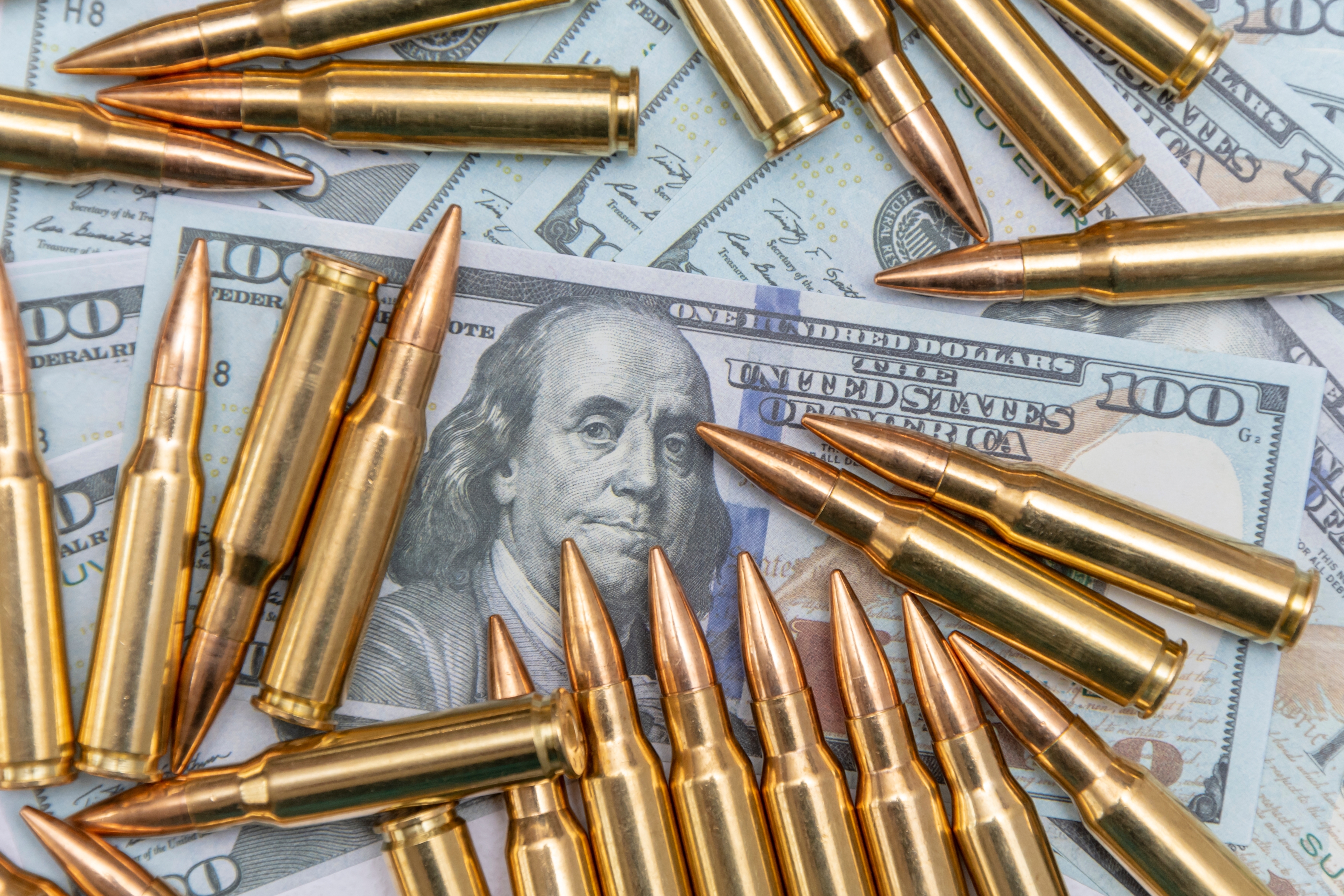 Money buys a lot of bullets. Illustration.