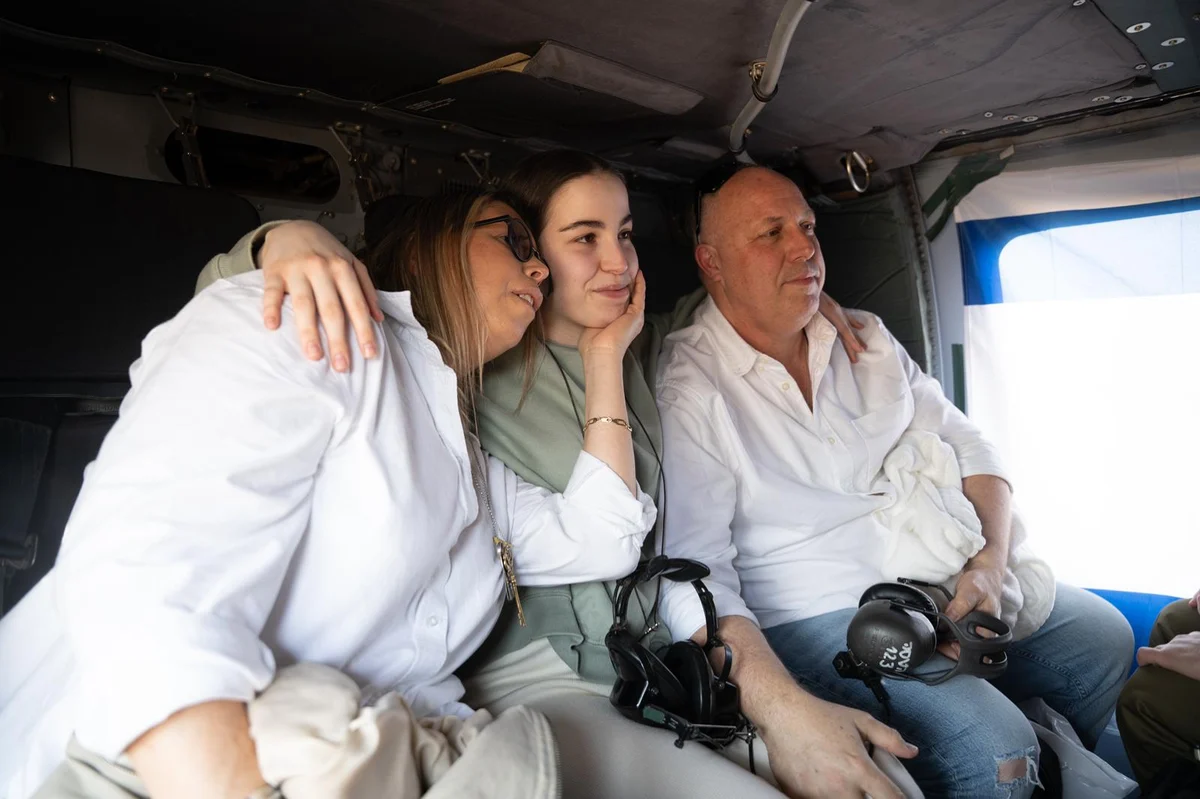 Freed hostage Agam Berger with her parents
