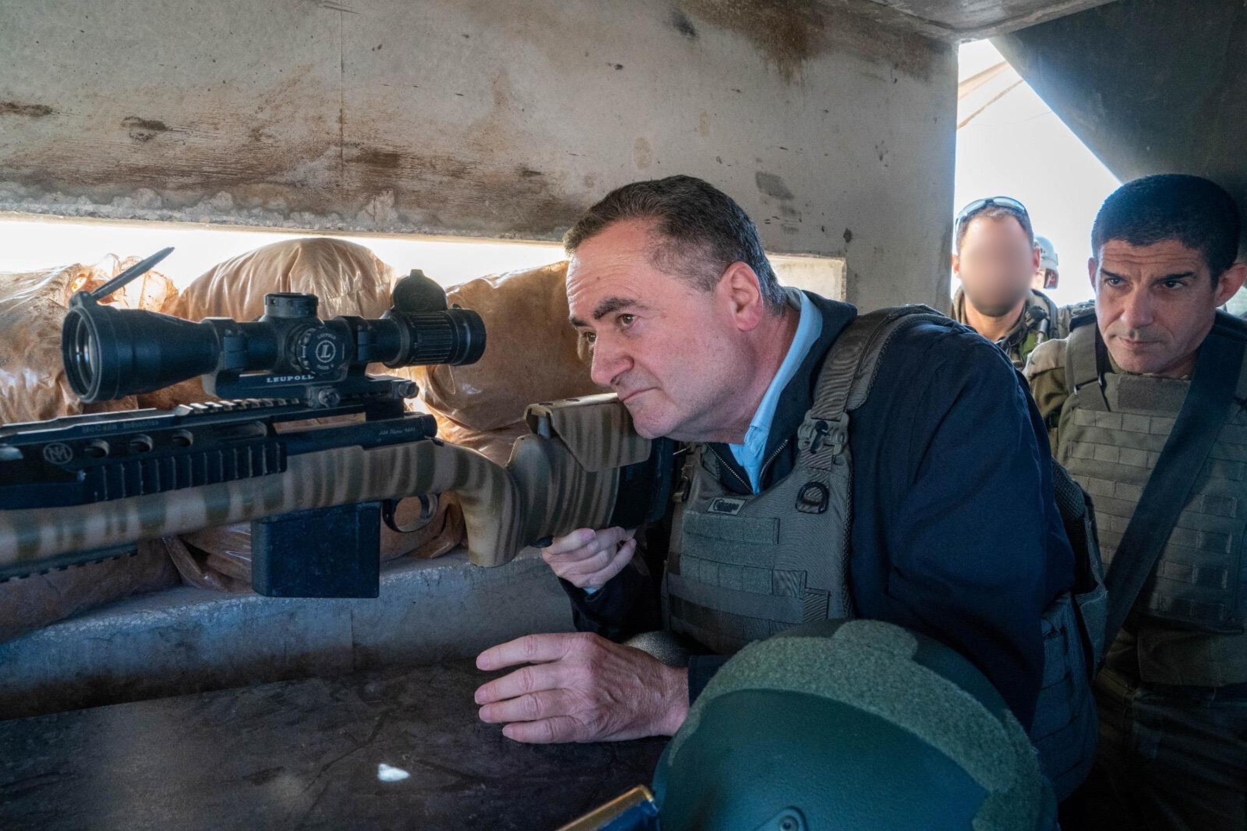 Defense Minister Katz looking through a sniper rifle.