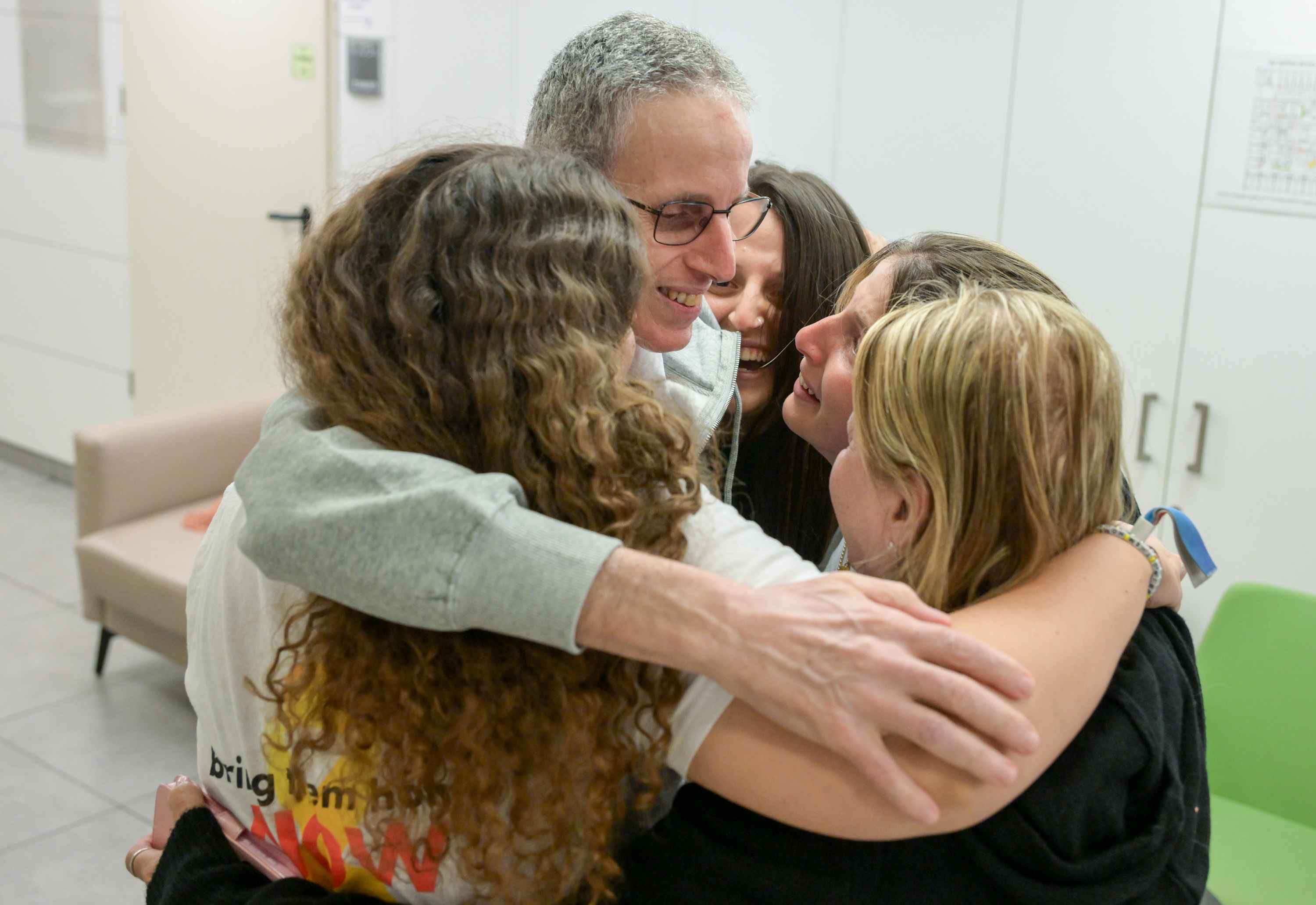 In color: Freed hostage Ohad Ben Ami reunites with his wife and daughters – and our hearts are so full