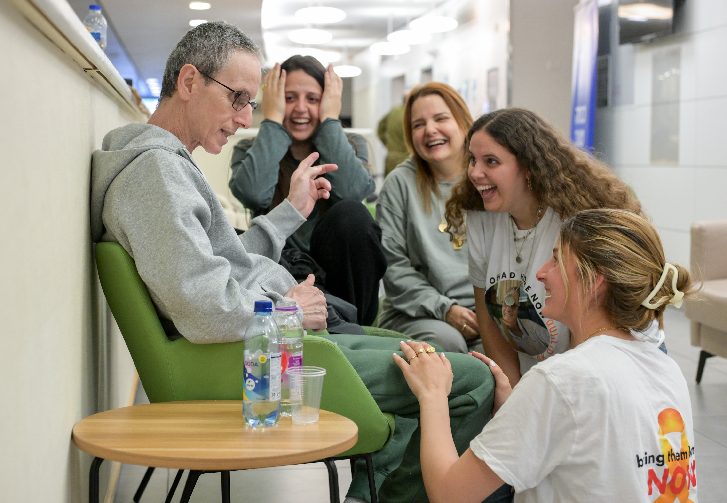In color: Freed hostage Ohad Ben Ami reunites with his wife and daughters – and our hearts are so full