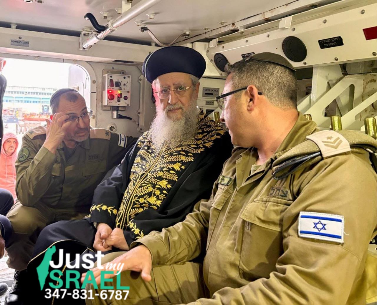 Chief Rabbi Dovid Yosef receives a tour of a tank following a chizuk  speech at an army base.