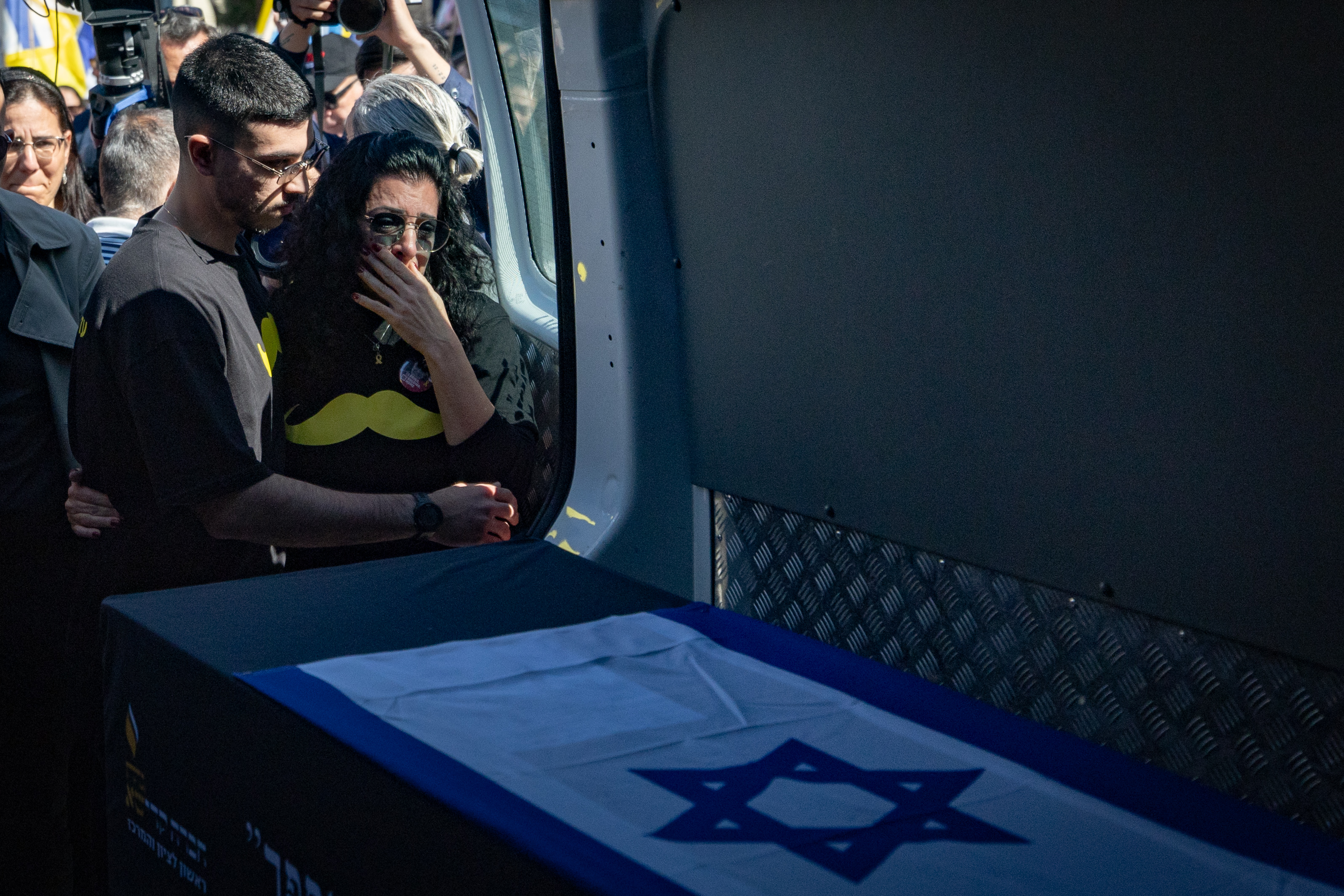 People pay their respects during the funeral service of slain Israeli hostage Shlomo Mantzur in Rishon LeTzion. Mantzur was murdered by Hamas terrorists in the October 7 massacre, and his body was taken to Gaza, March 2, 2025