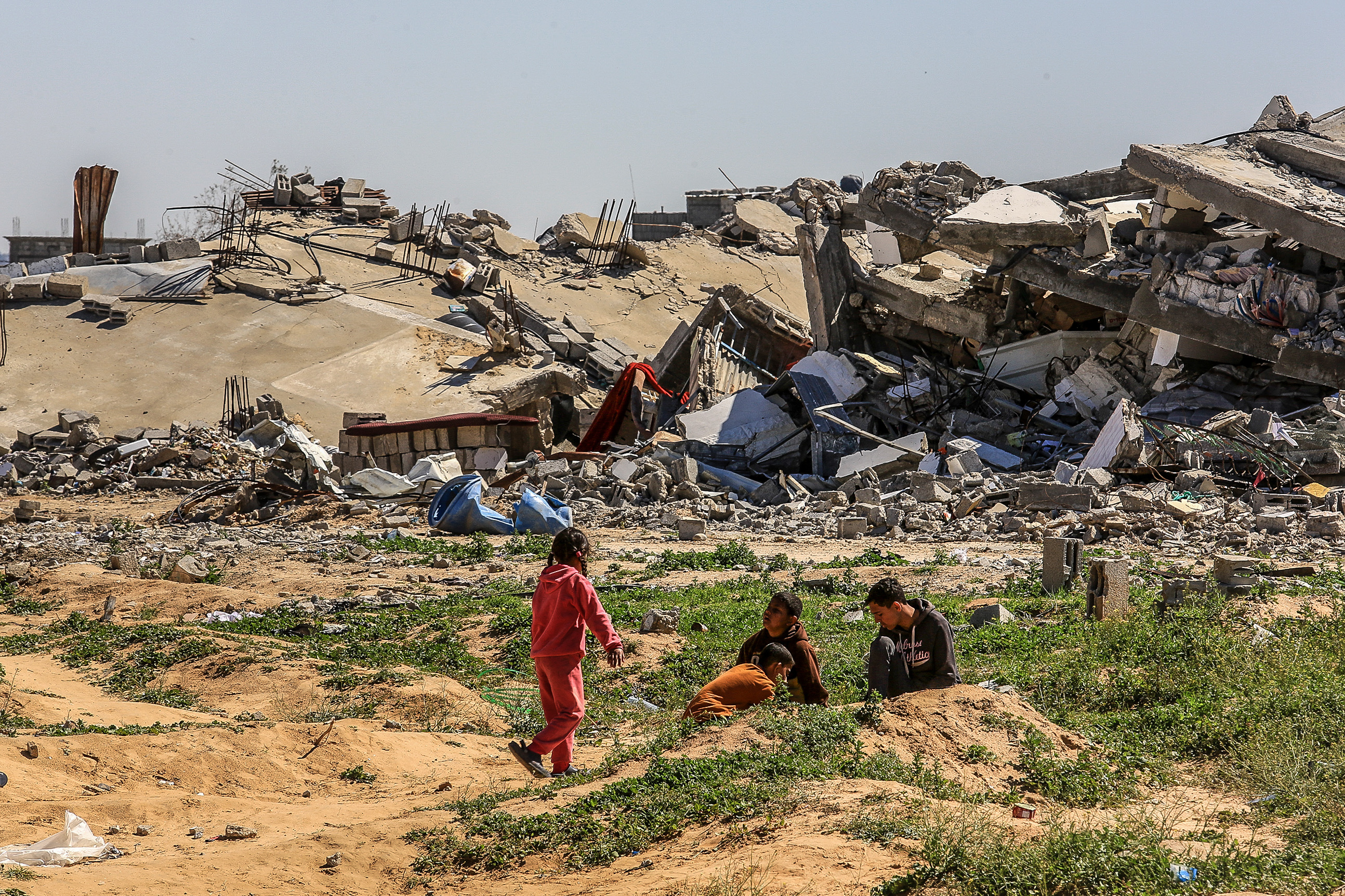 Palestinians l on a road near the Kerem Shalom crossing, east of the city of Rafah, in the southern Gaza Strip, March 2, 2025.