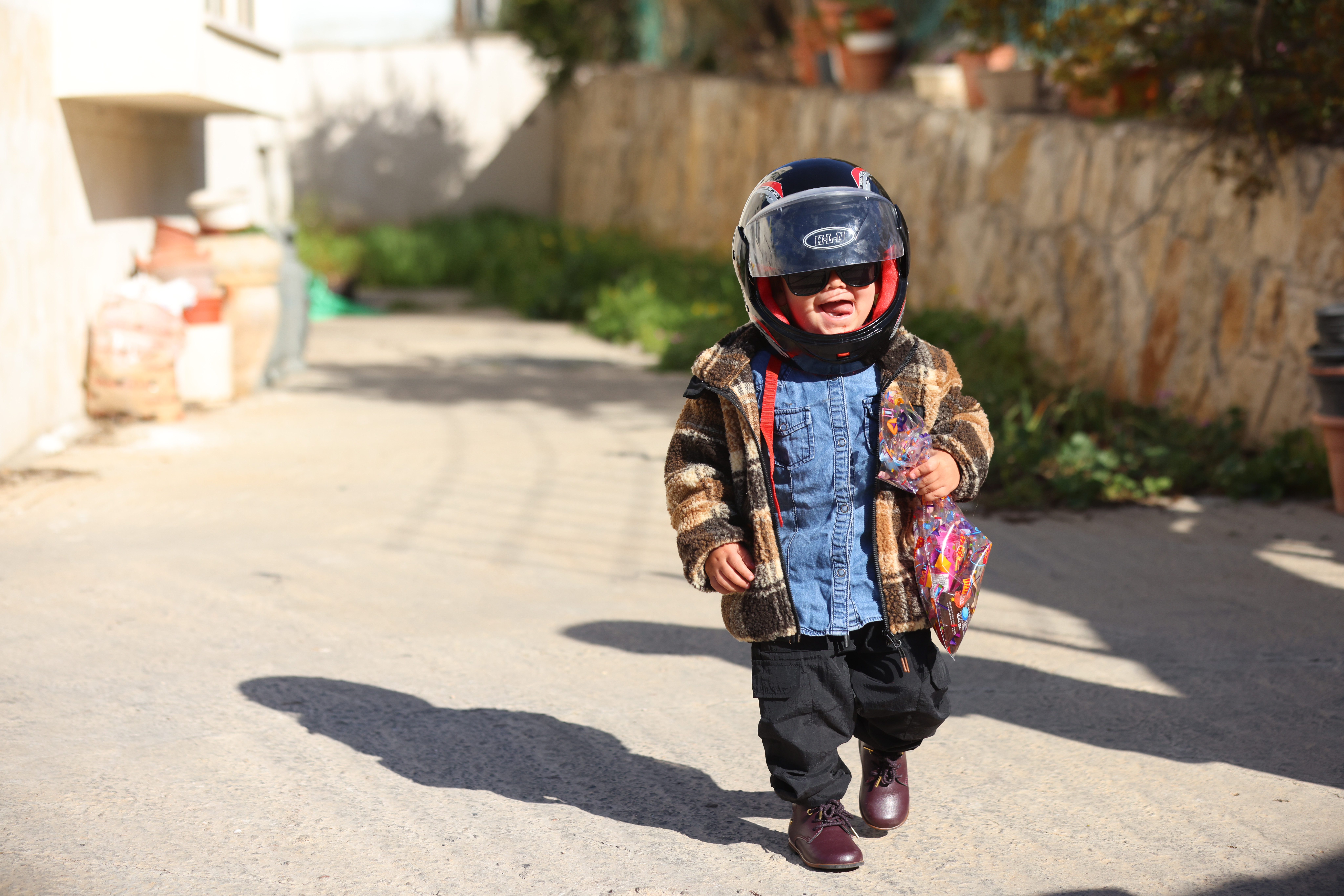 sraeli children dressed up in costumes ahead of the the Jewish holiday of Purim, in the Northern Israeli town of Tzfat, March 12, 2025. 