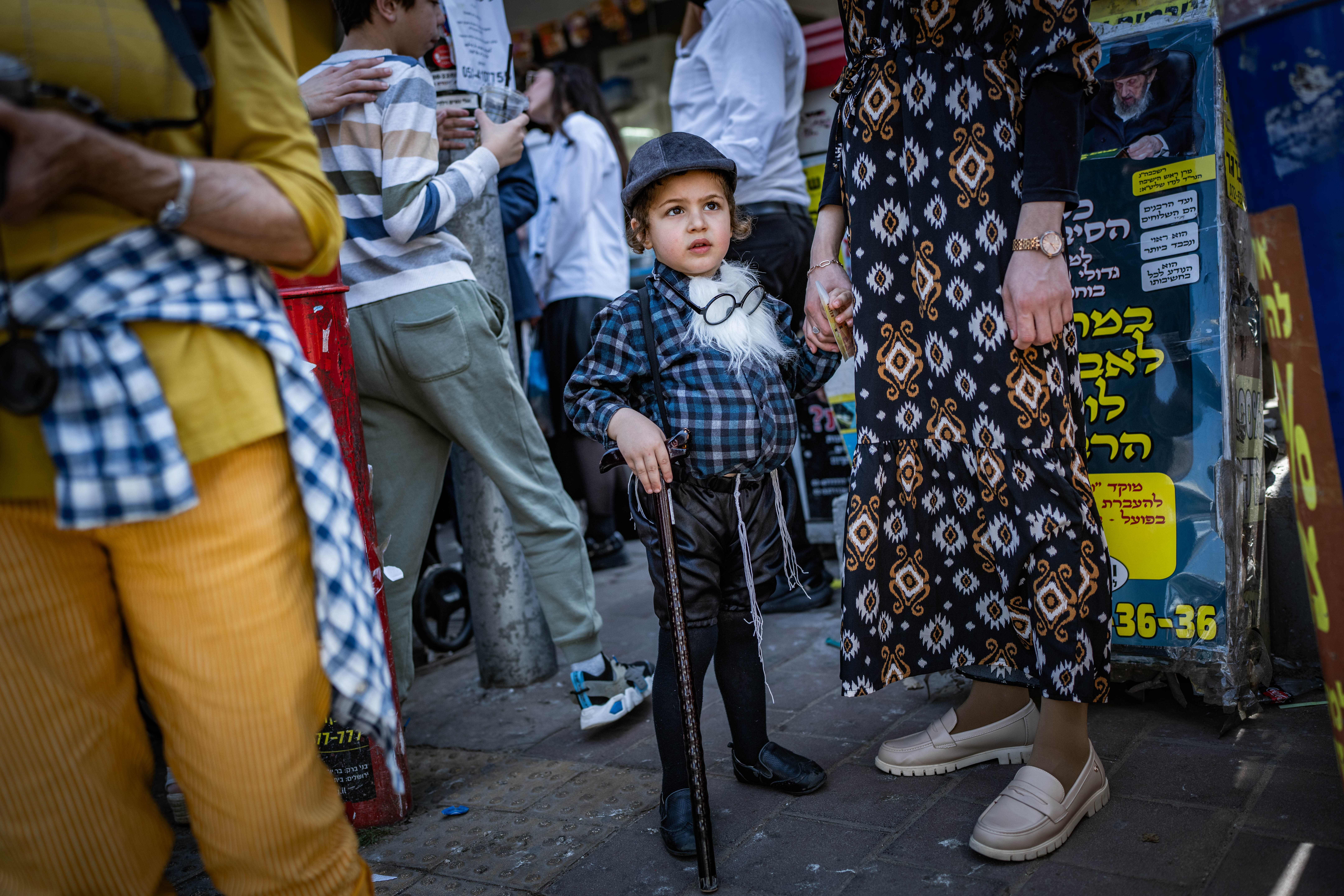 Ultra Orthodox Jews celebrate the Jewish festival of Purim, in the ultra-Orthodox town of Bnei Brak on March 14, 2025.