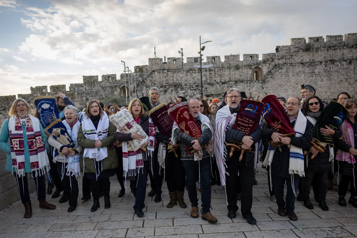 Director General of the 'World Center' movement Mr. Mauricio Balter and member of the organization's board Mr. Yizhar Hess lead a procession with Torah scrolls as part of the Women of the Wall activity on Rosh Chodesh