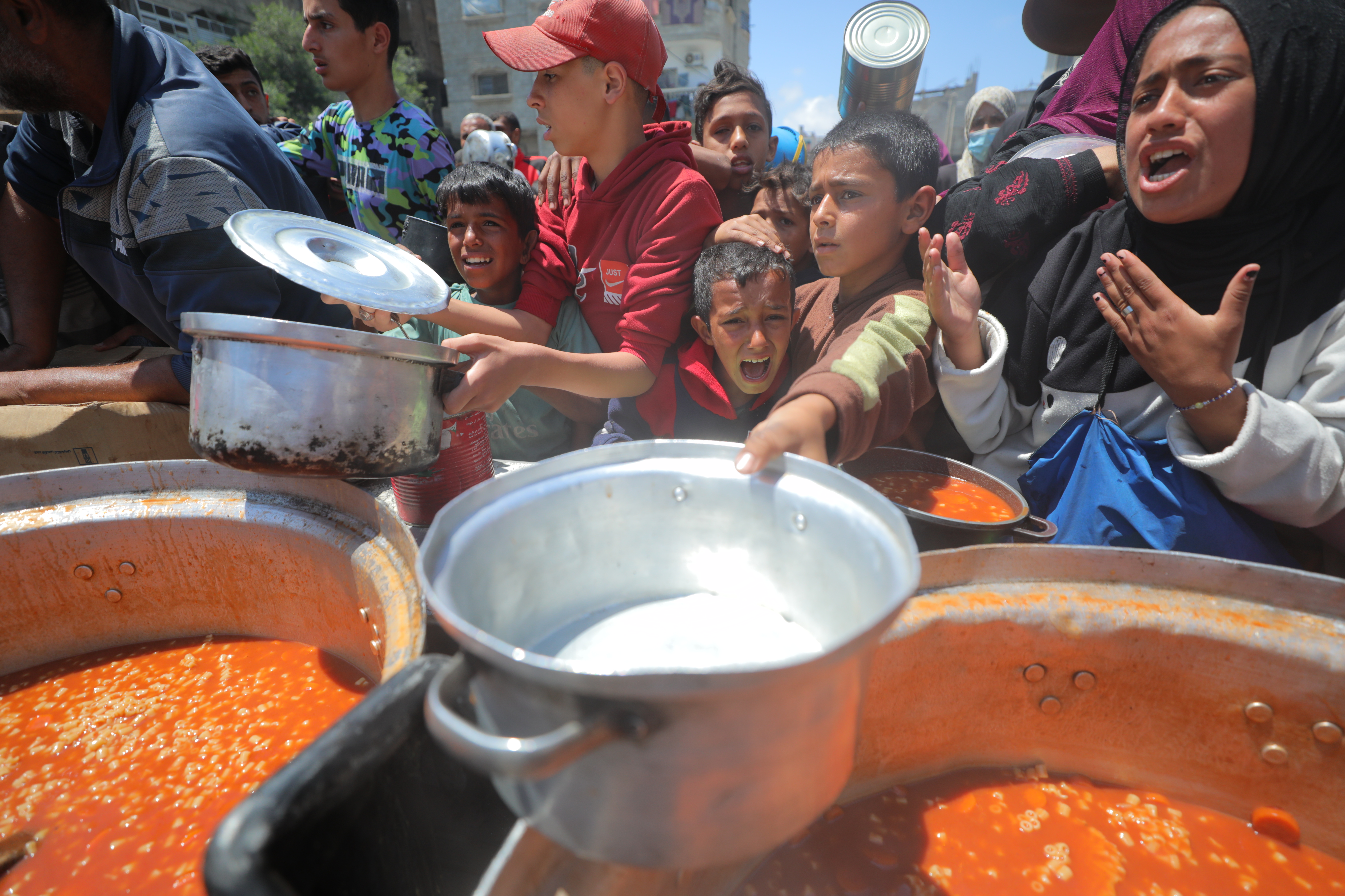 Hungry Gazans seeking aid.