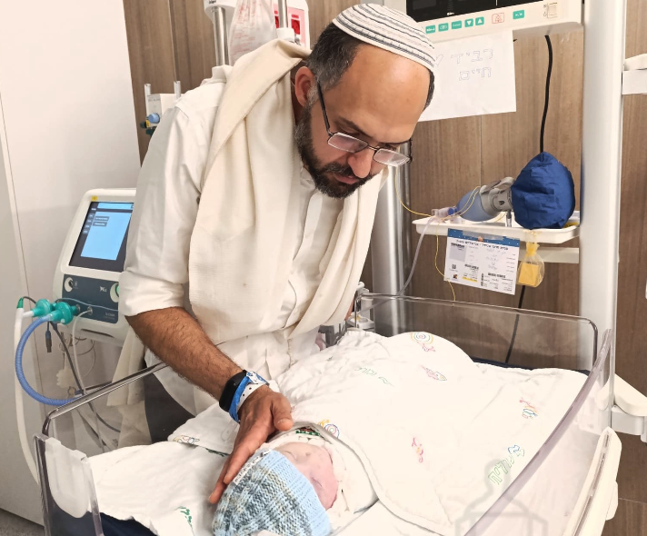 Hananel Gez bids a final farewell to his son Ravid Chaim