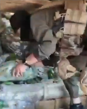 Julani's forces seizing weapons.