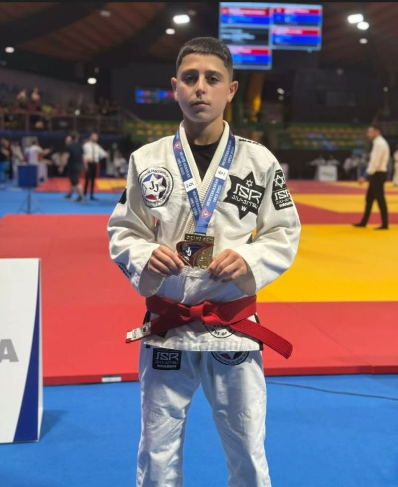 Israeli teen athlete Daniel Boaron wins gold, but is forced to receive his medal in secret, authorities cite "security concerns"