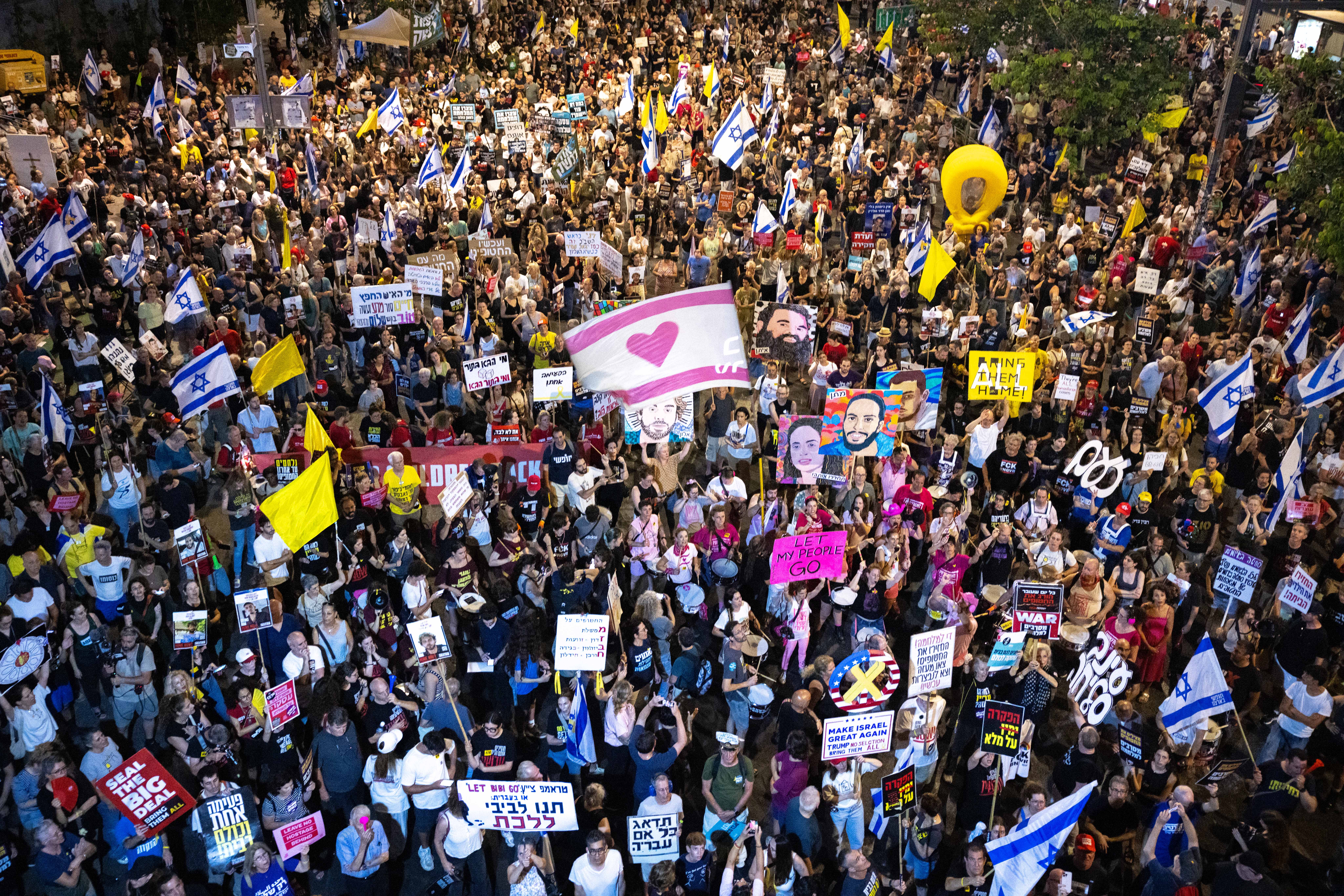 Demonstrators protest against the Israeli government and for the release of Israelis held hostage in the Gaza Strip outside Hakirya Base in Tel Aviv, July 5, 2025. 