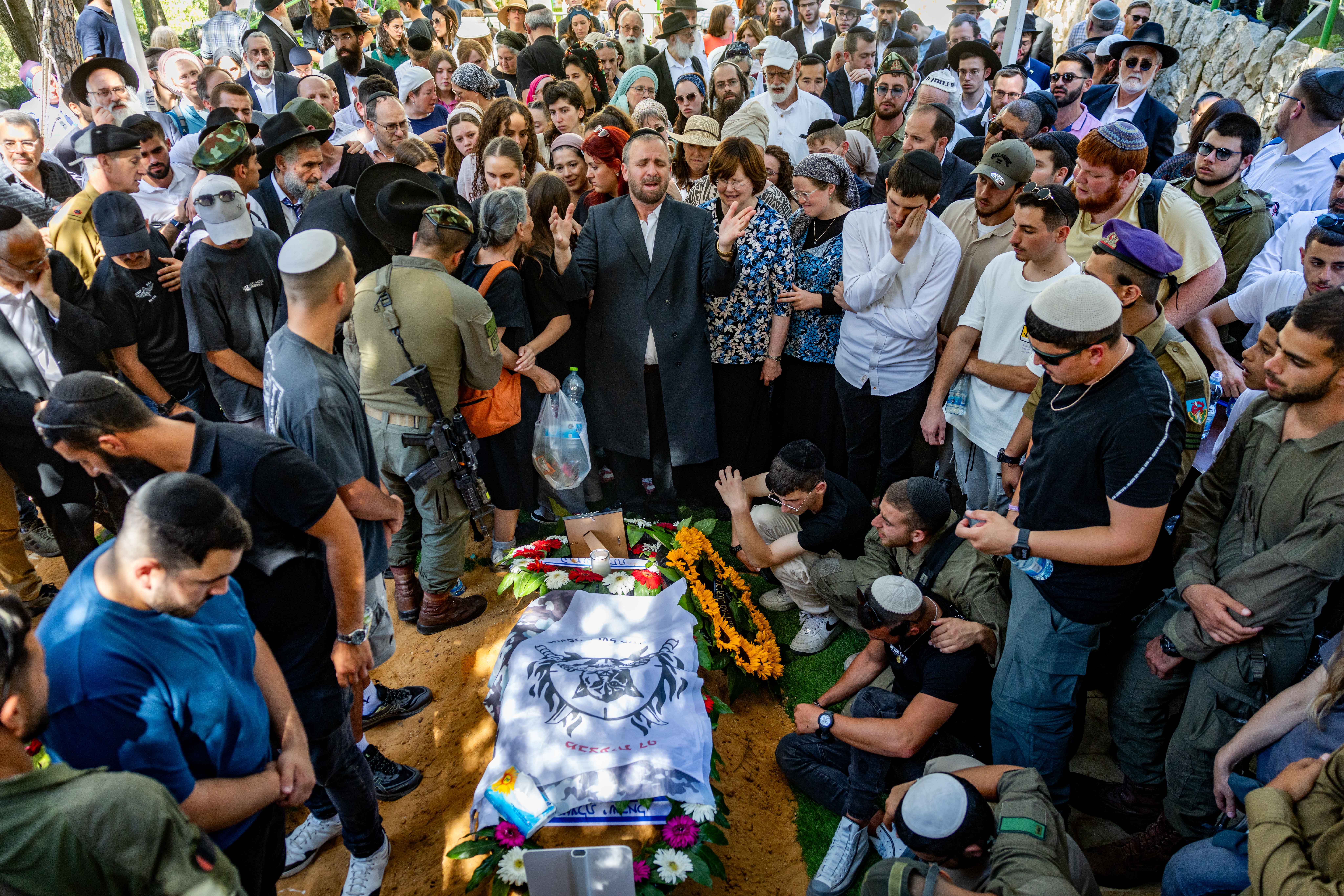 Family and friends of Israeli soldier Staff sergeant Moshe Shmuel Noll attend his funeral at the Mount Herzl Military Cemetery in Jerusalem on July 9, 2025. He was killed in combat in the Gaza Strip.
