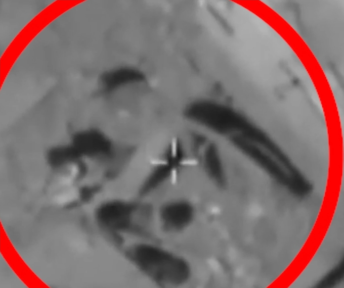 Eliminating terrorists trying to bury IEDs.