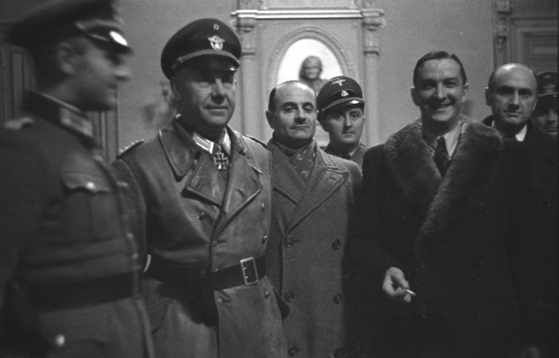 René Bousquet, Secretary-General of the Vichy Regime (wearing the fur coat), meeting with Nazi officers in Marseille, 1943.