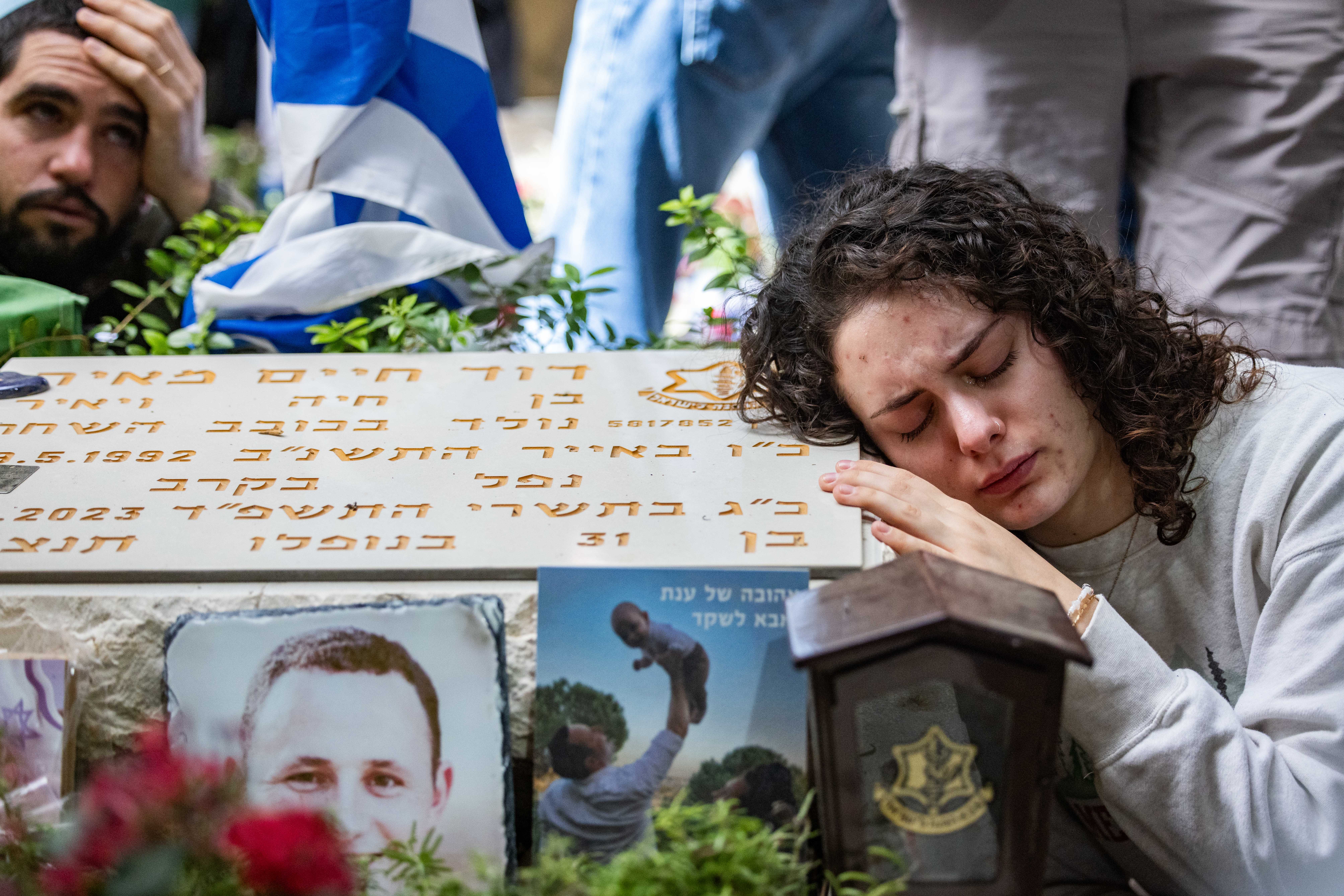 Family and Friends mourn over the grave of Sayeret Matkal soldier David Meir, killed by Hamas terrorists on October 7 at the battle on Kibbutz Be'eri