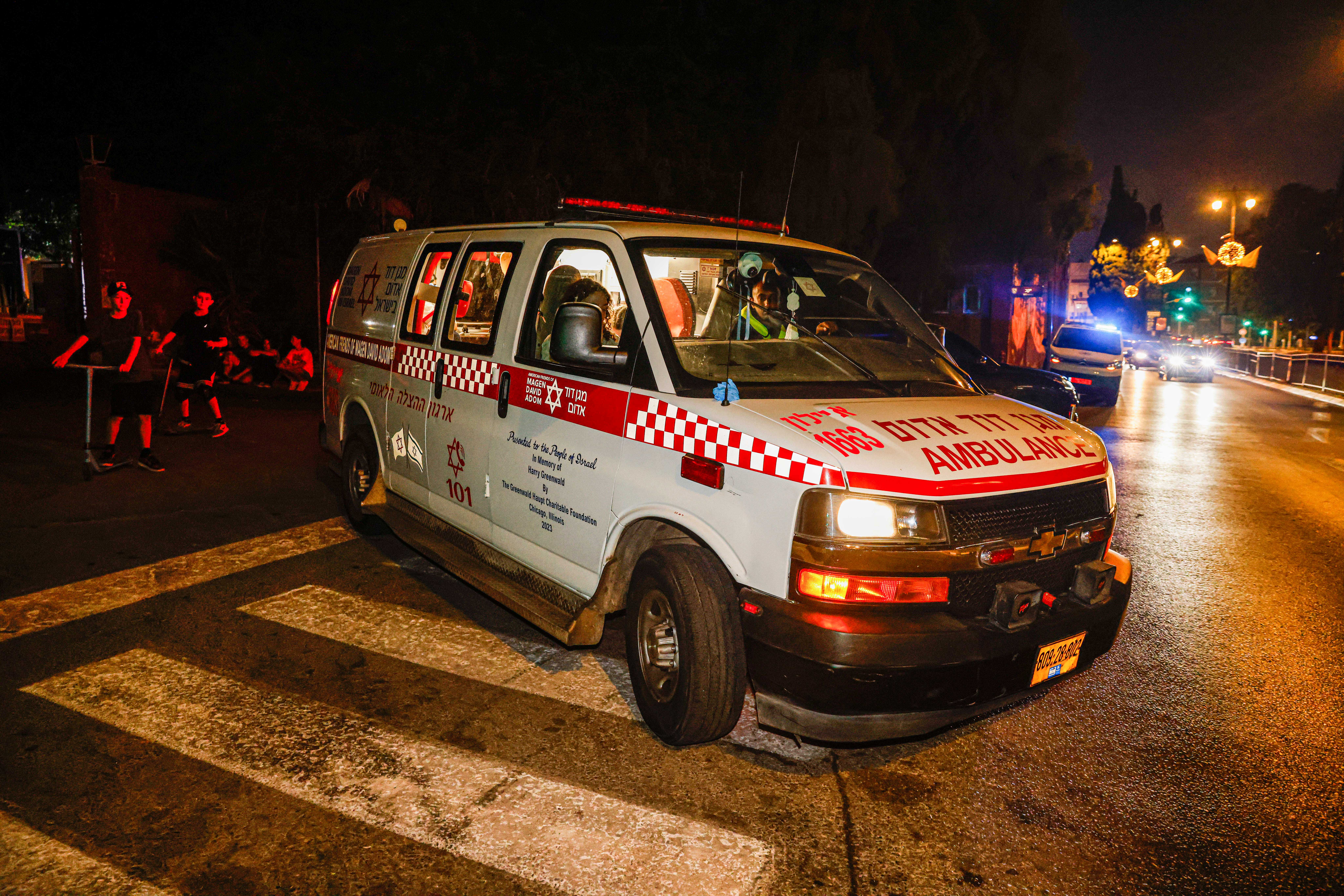 Israeli rescue and security forces at the scene where two teenage girls fell from the roof of a building in Rishon LeZion, central Israel, August 3, 2025. 
