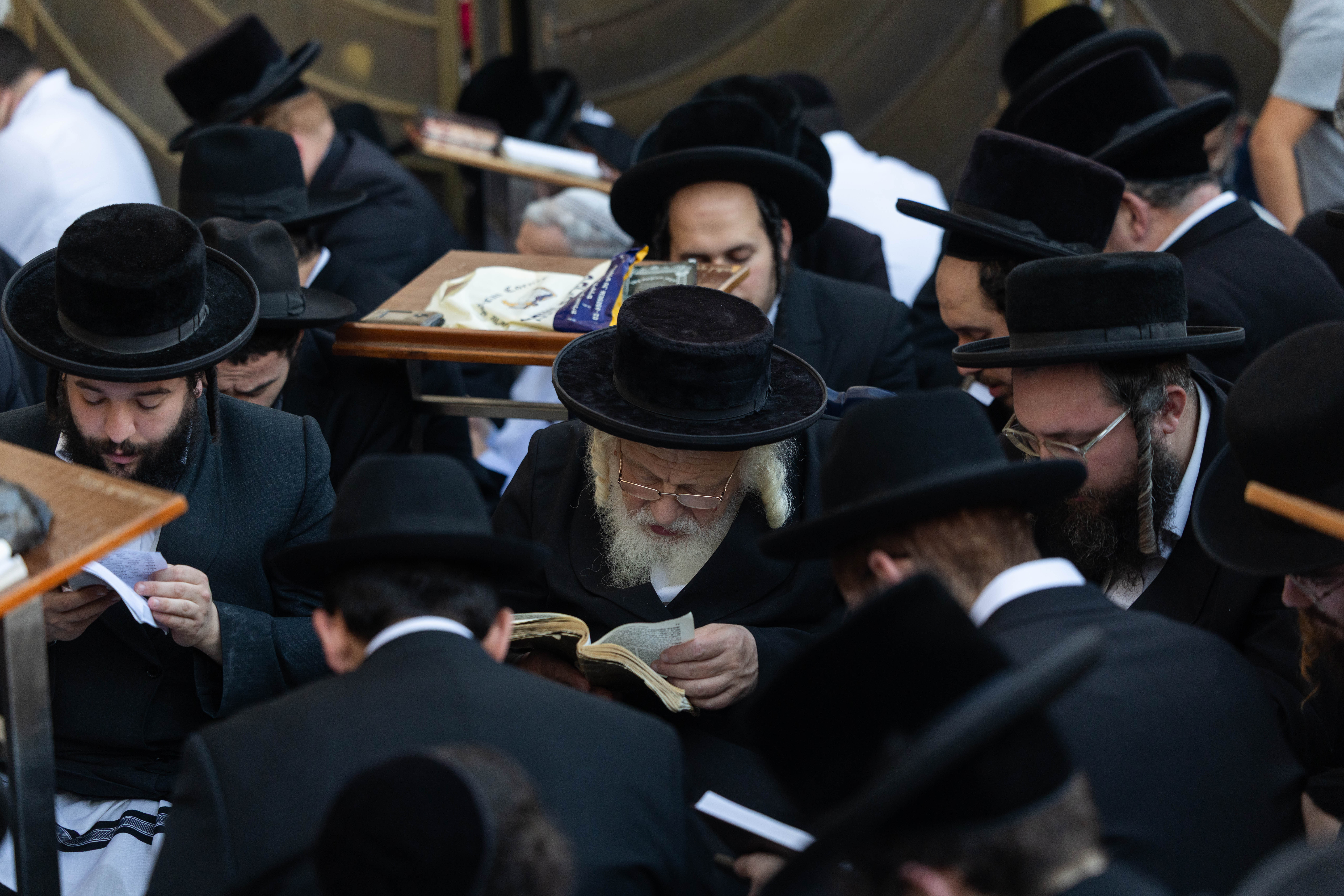 Jewish men pray during at the Western Wall in Jerusalem’s Old City, August 3, 2025. 