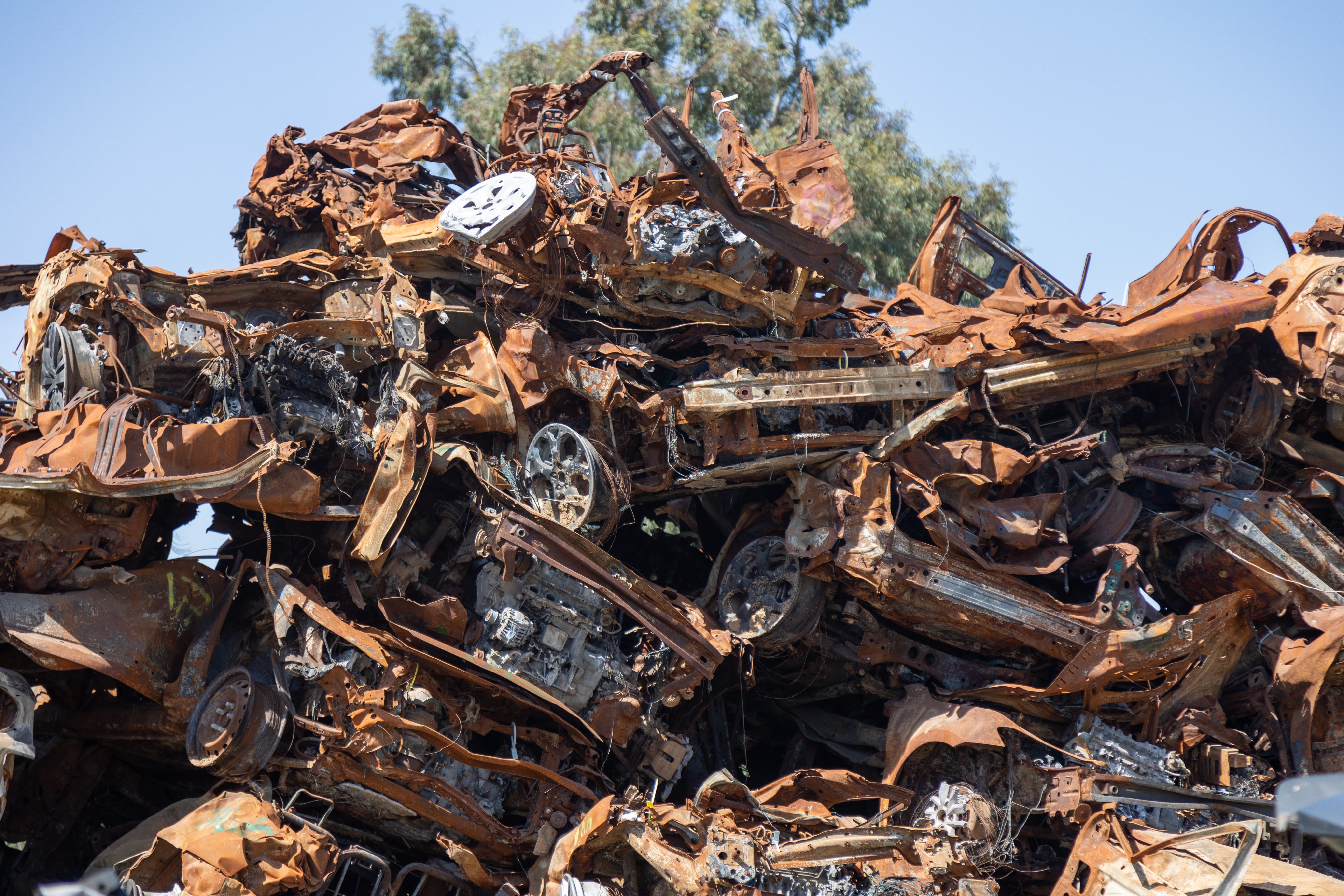 Sa'ad, Israel – May 9 2024, Cars remaining, burned cars after the attack on October 7th by Hamas. The cars were collected on the farmer's filled and serves now as a memorial and a remainder.