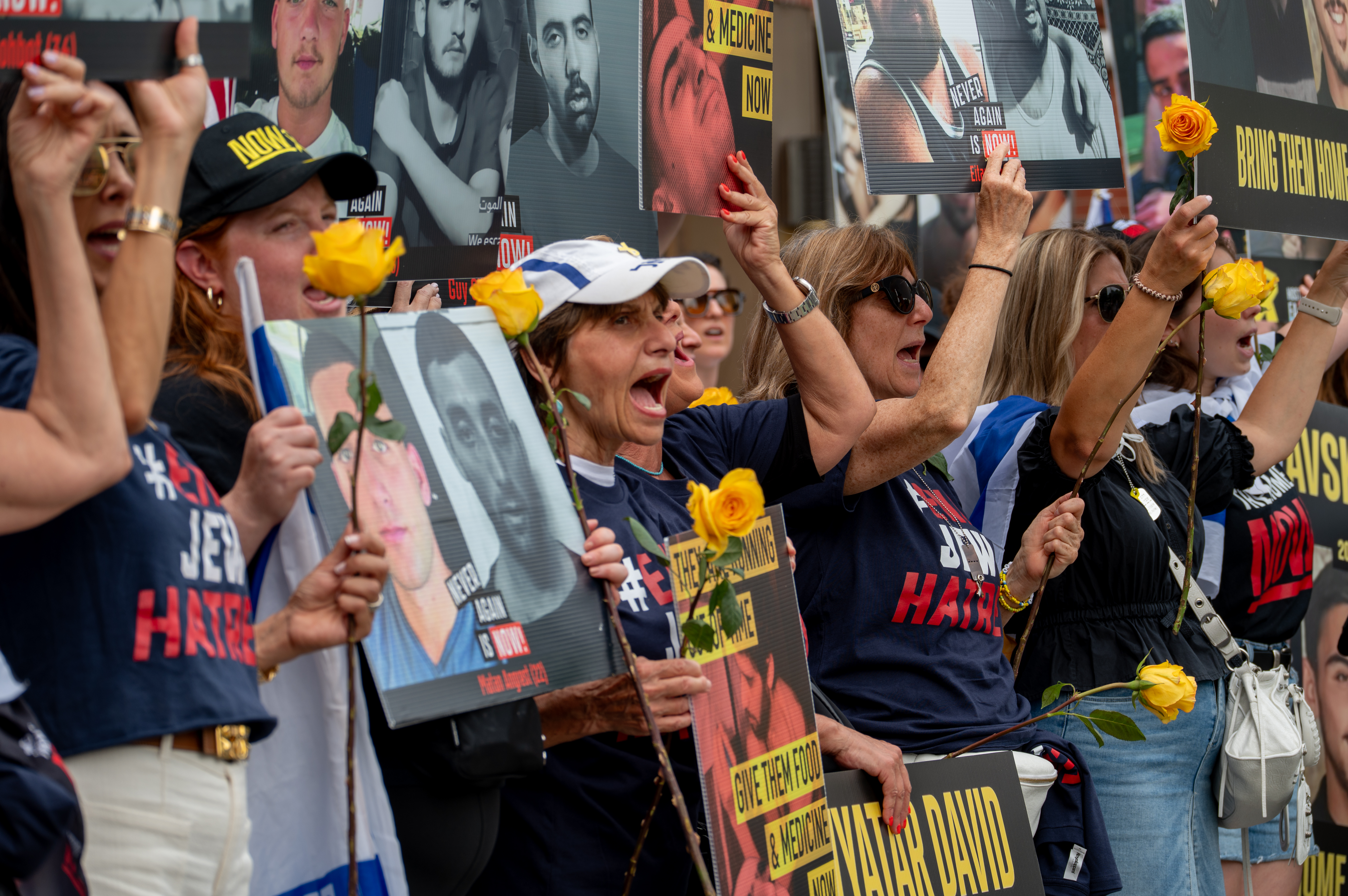 People protest for the release of hostages held in the Gaza Strip outside the United Nations headquarters in New York City, August 5, 2025. 