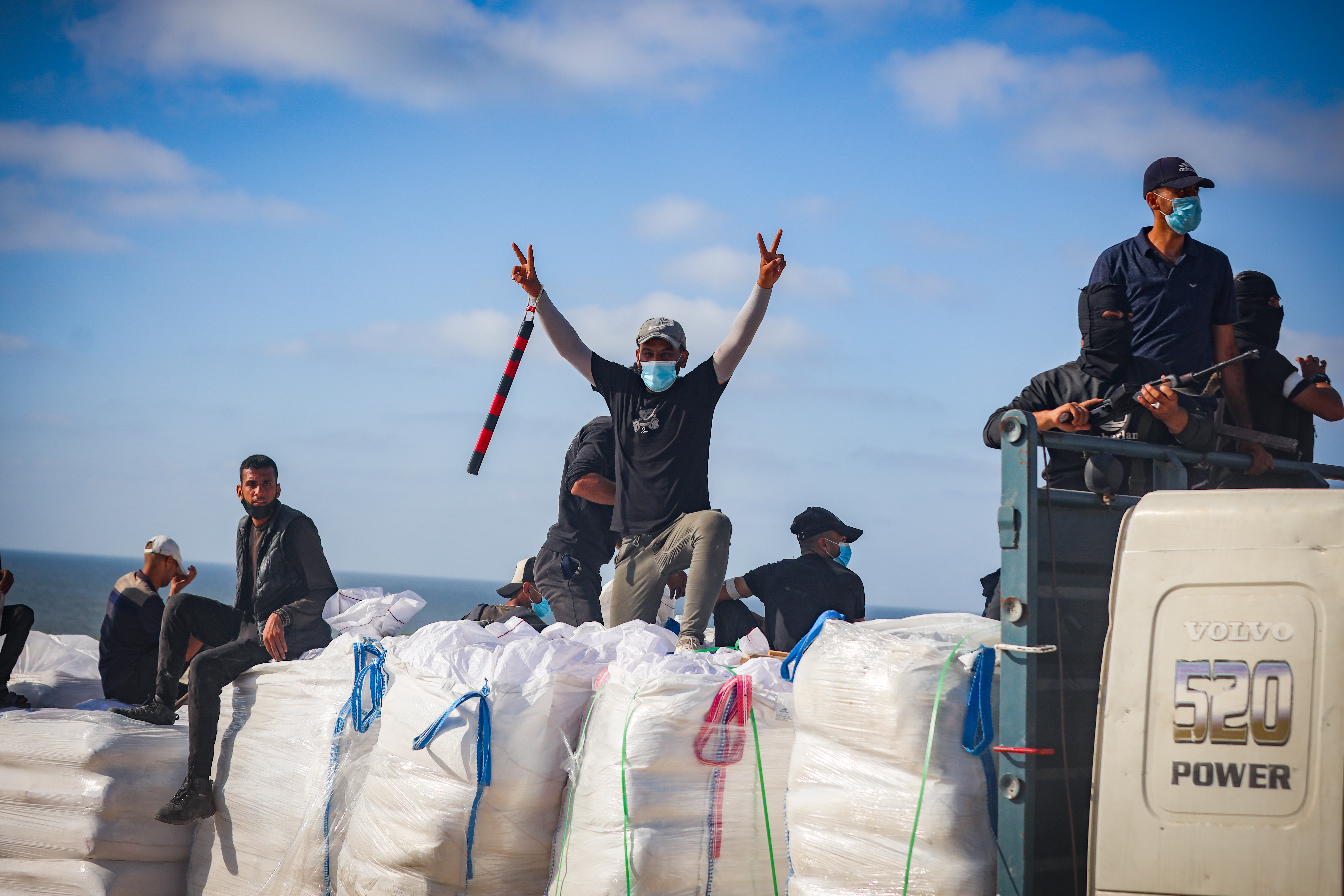 Armed Palestinians on top an aid truck.