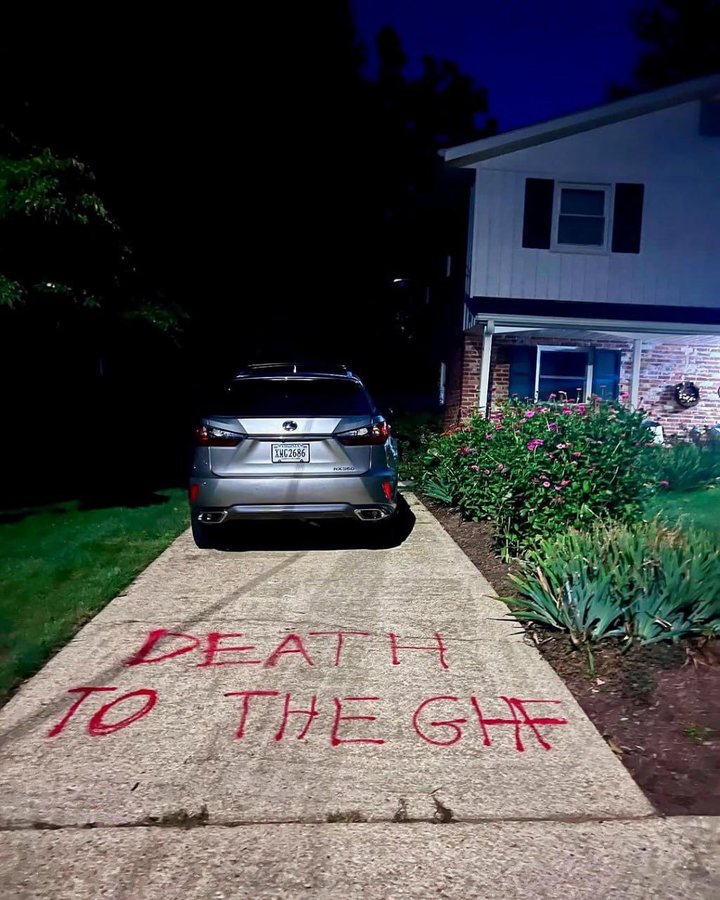 “Death to GHF” outside the home of U.S. aid organization’s acting chief.