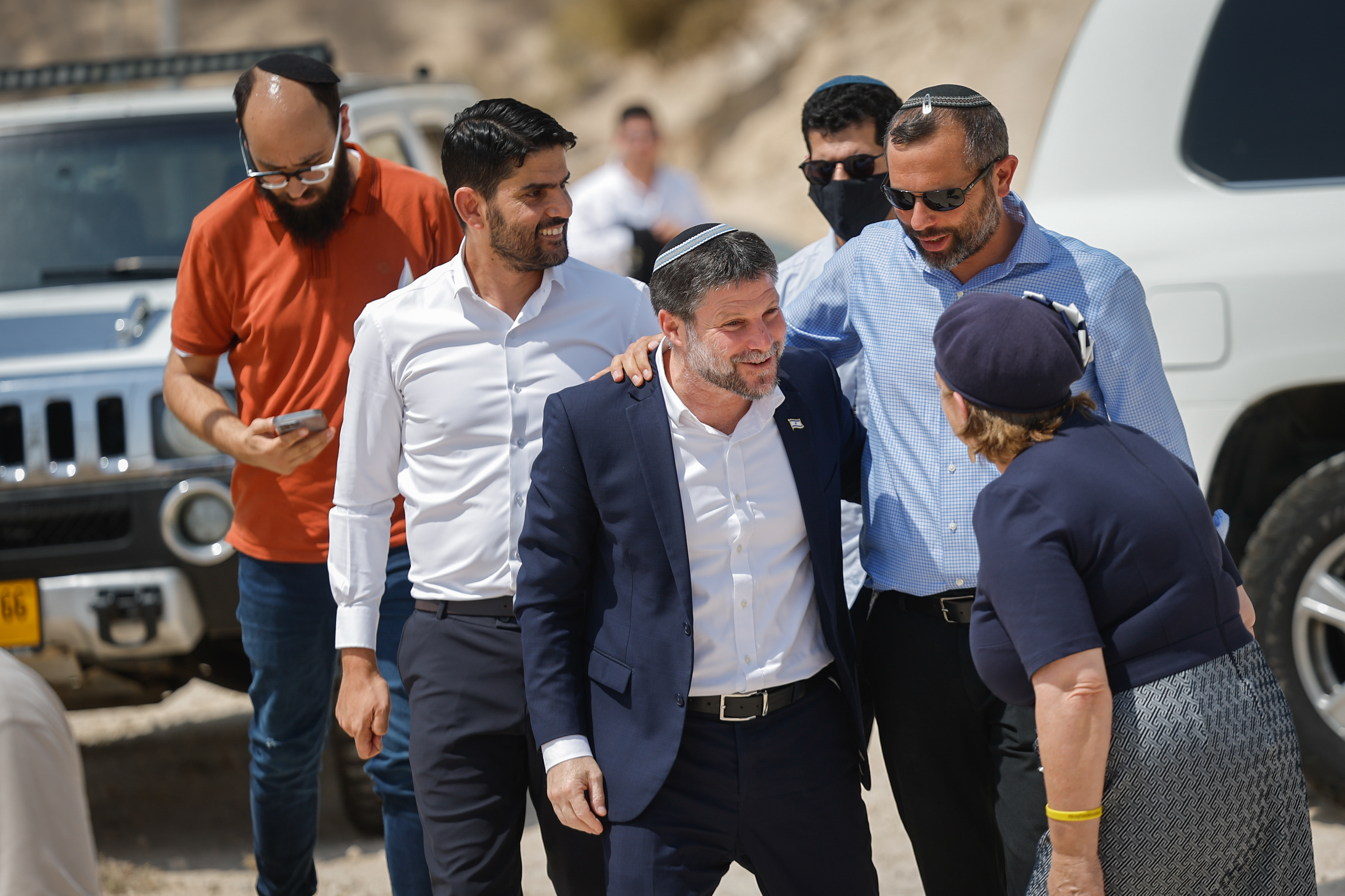 Smotrich arrives to a press conference announcing his plans to approve more than 3,000 housing units in the E1 settlement project between Jerusalem and Ma’ale Adumim, August 14, 2025.