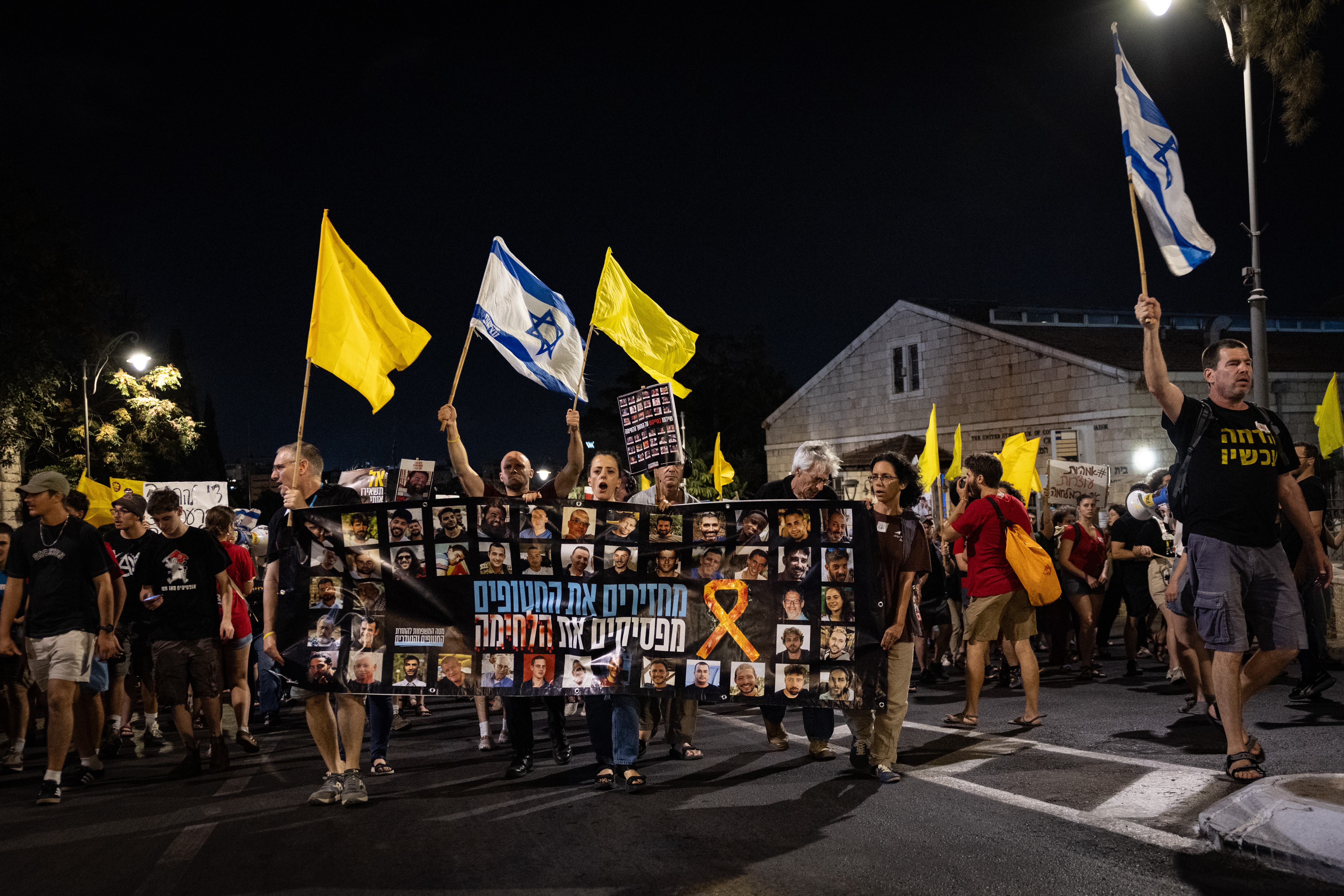 People protest calling for the release of hostages held in the Gaza Strip, near the Prime Minister's residence in Jerusalem, August 16, 2025