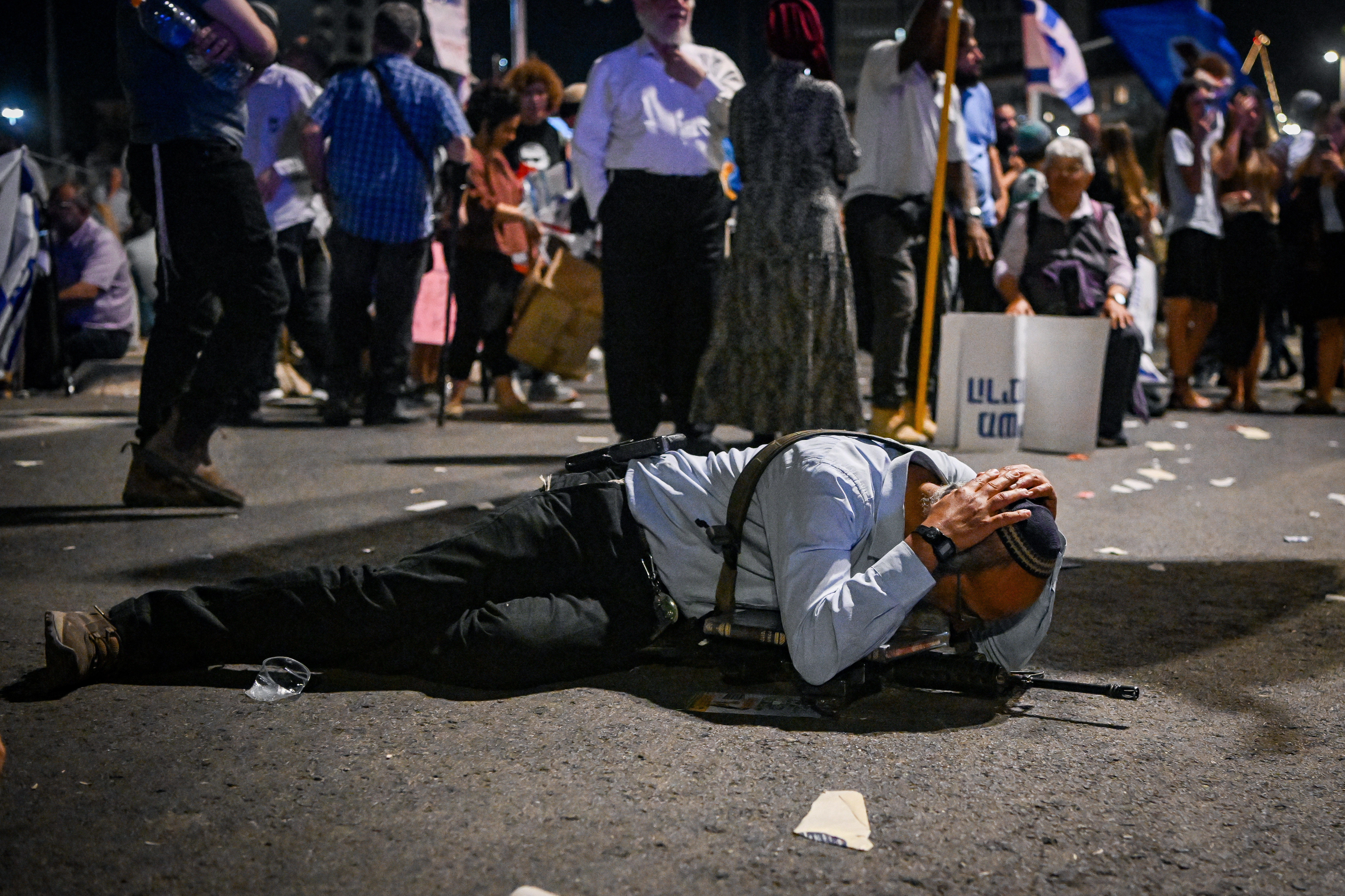 People take cover as siren warns of incoming missile fired from Yemen