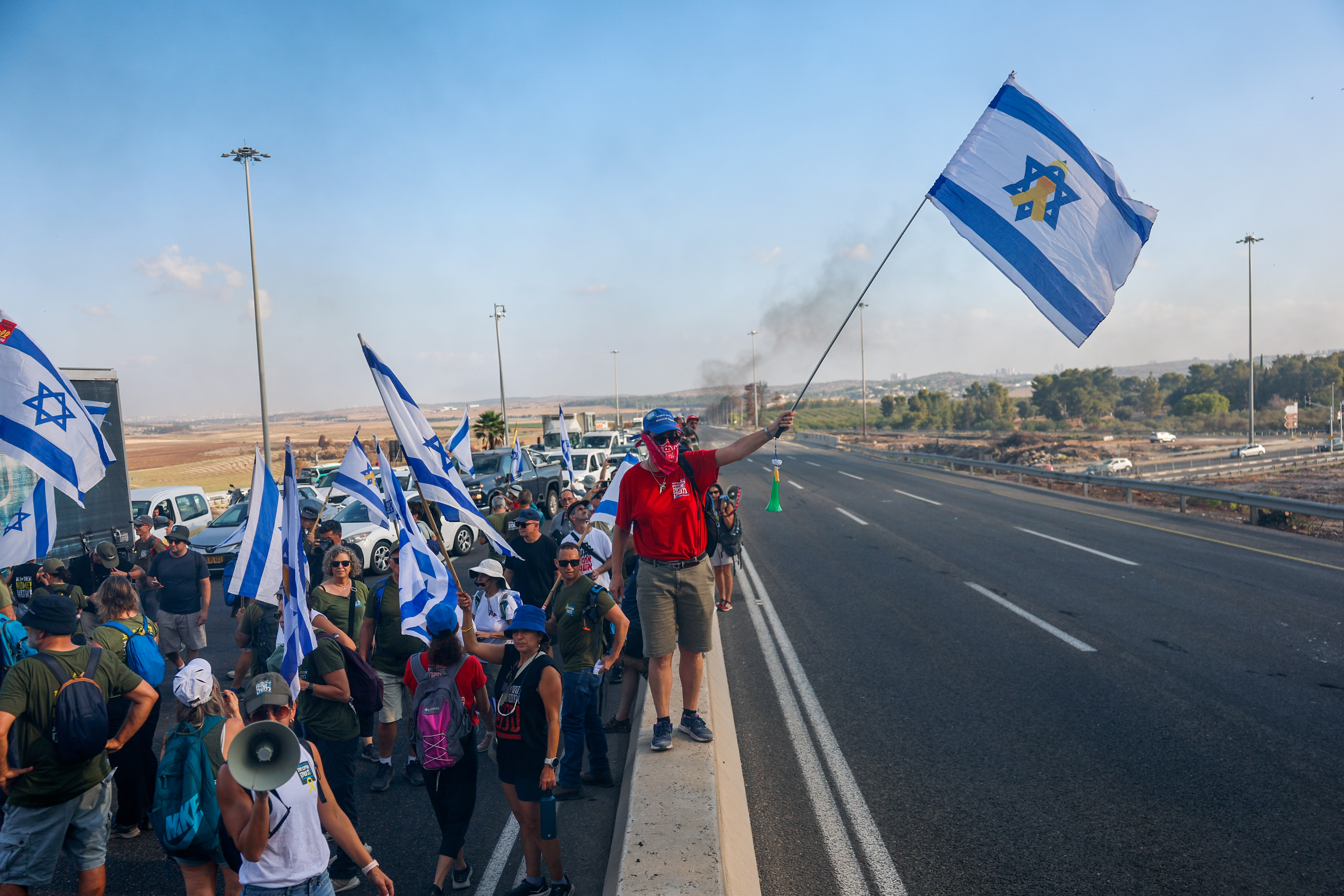 Israelis block road 1 near Latrun, while attending a protest calling for the release of the Israeli hostages held by Hamas in Gaza, August 17, 2025.