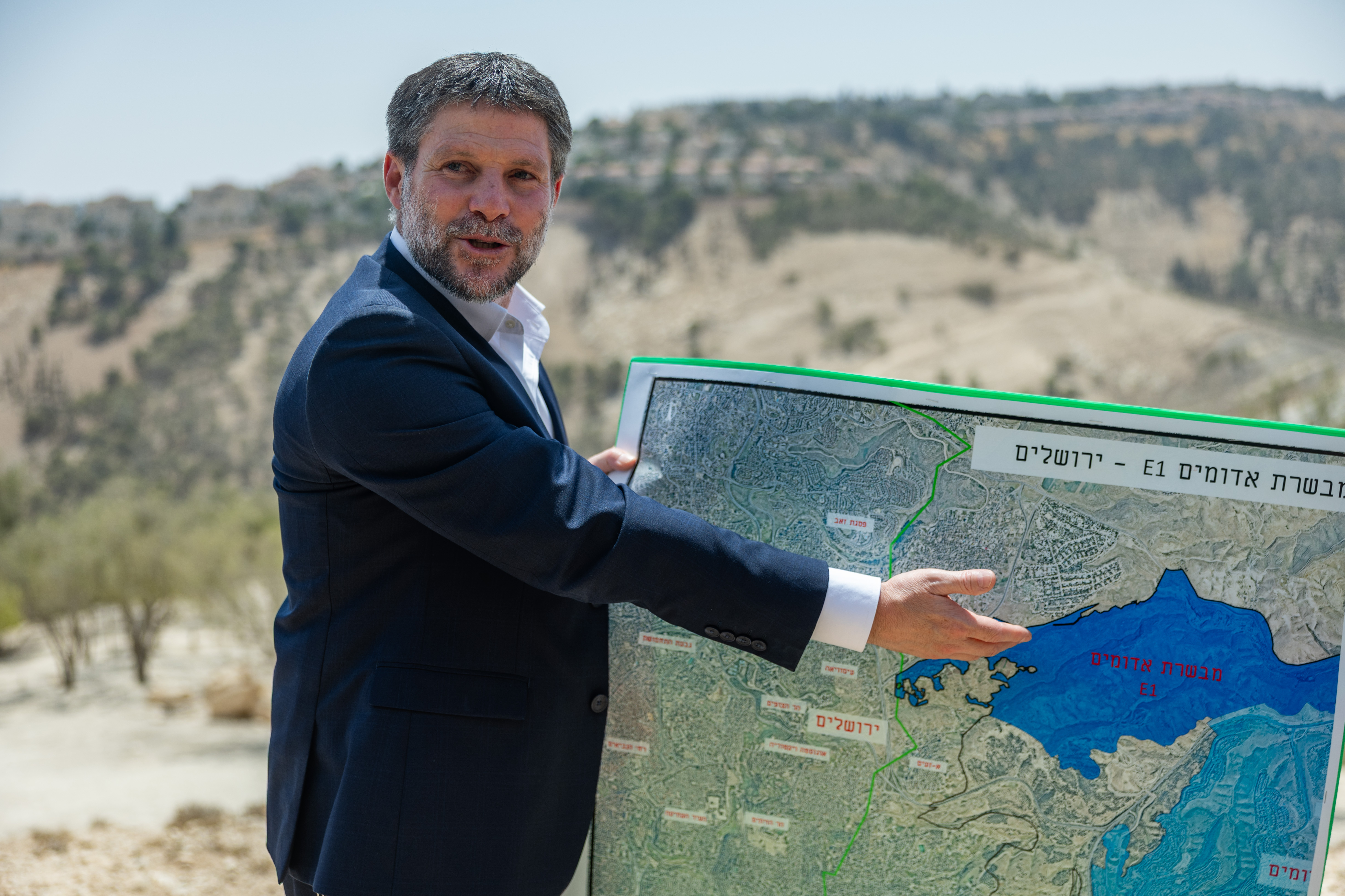 Israeli minister of Finance Bezalel Smotrich attends a press conference announcing his plans to approve more than 3,000 housing units in the E1 settlement project between Jerusalem and Ma’ale Adumim, August 14, 2025.