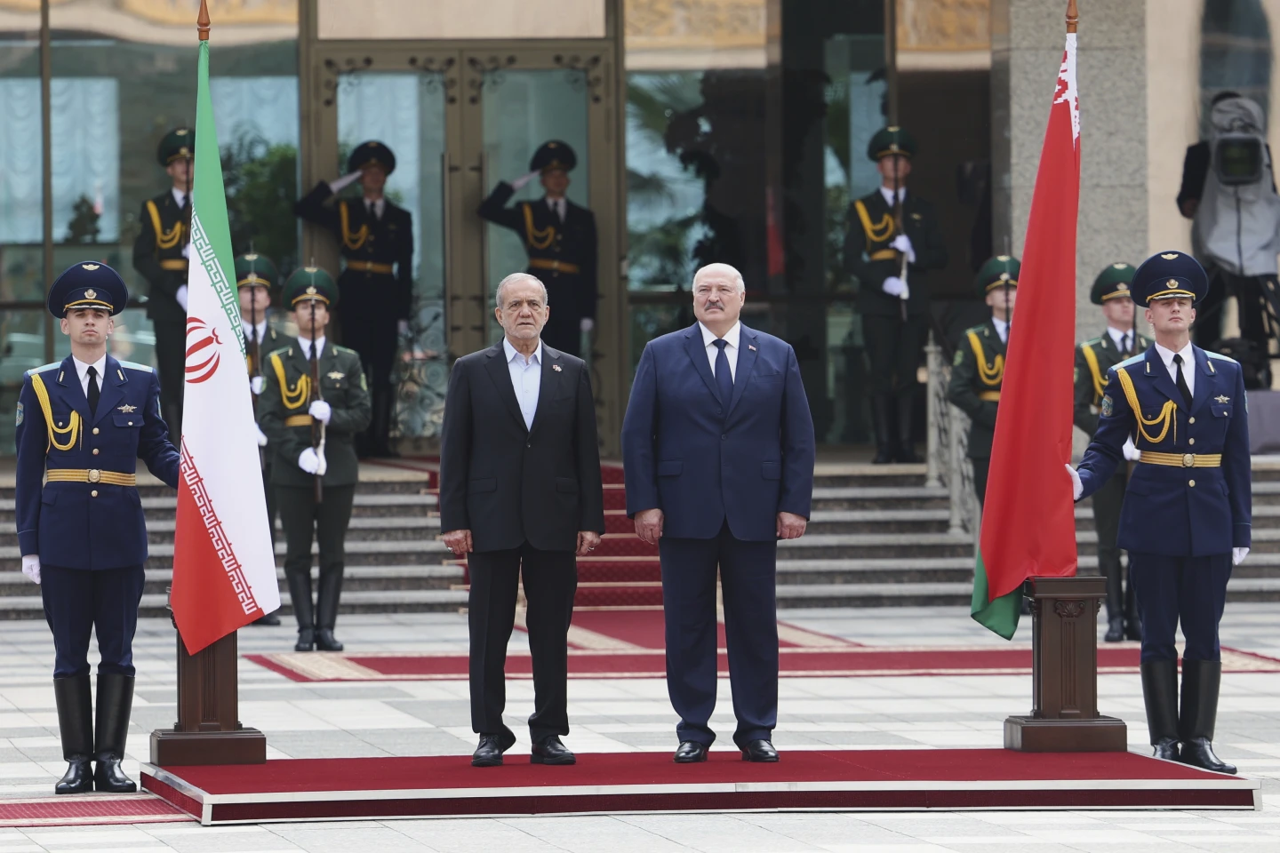 Belarusian President Alexander Lukashenko, center right, and Iranian President Masoud Pezeshkian, center left, attend cerimony on August 20th