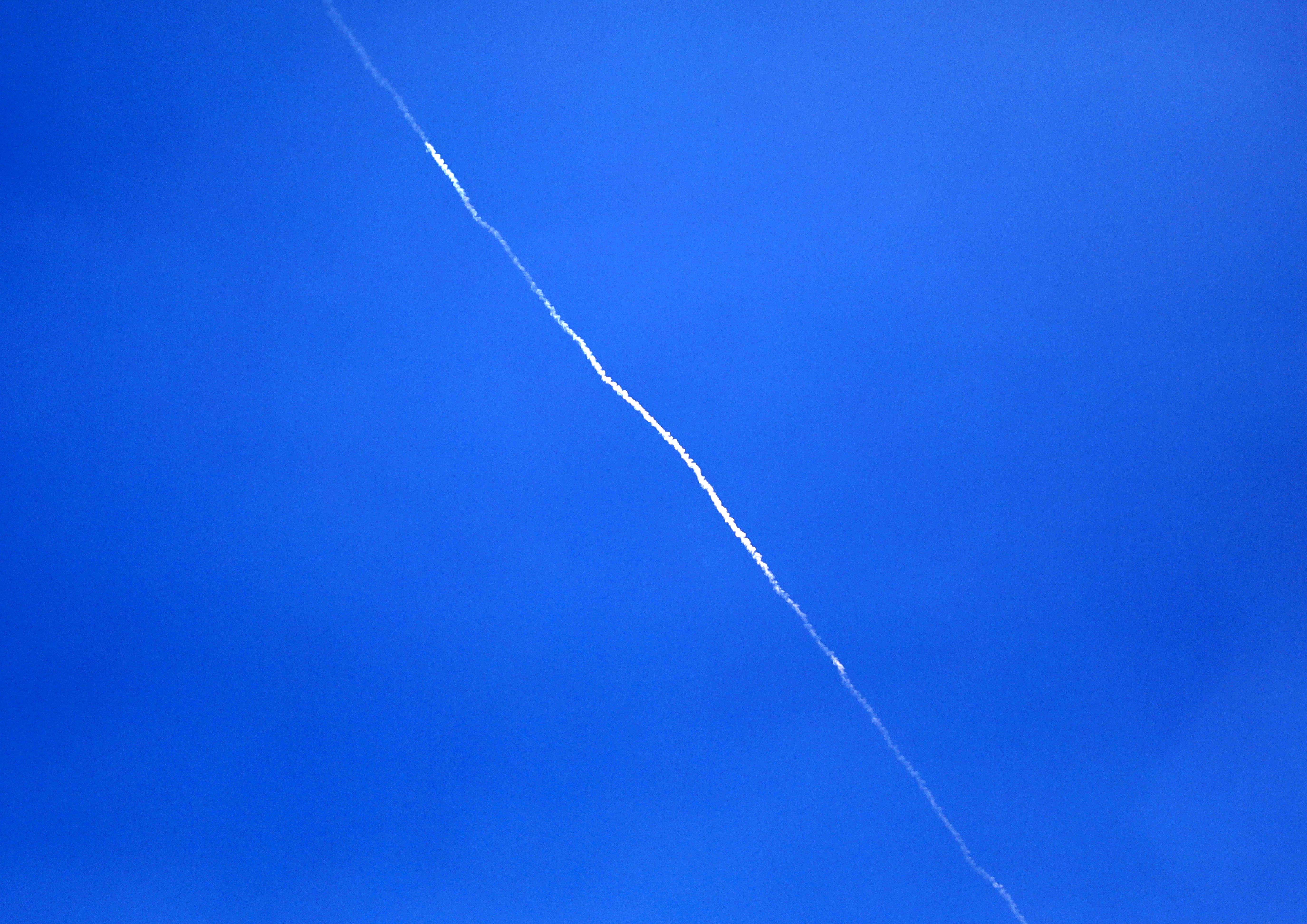 An Israeli air defense system launches interceptor missiles toward an incoming ballistic missile fired from Yemen, as seen from the city of Hebron