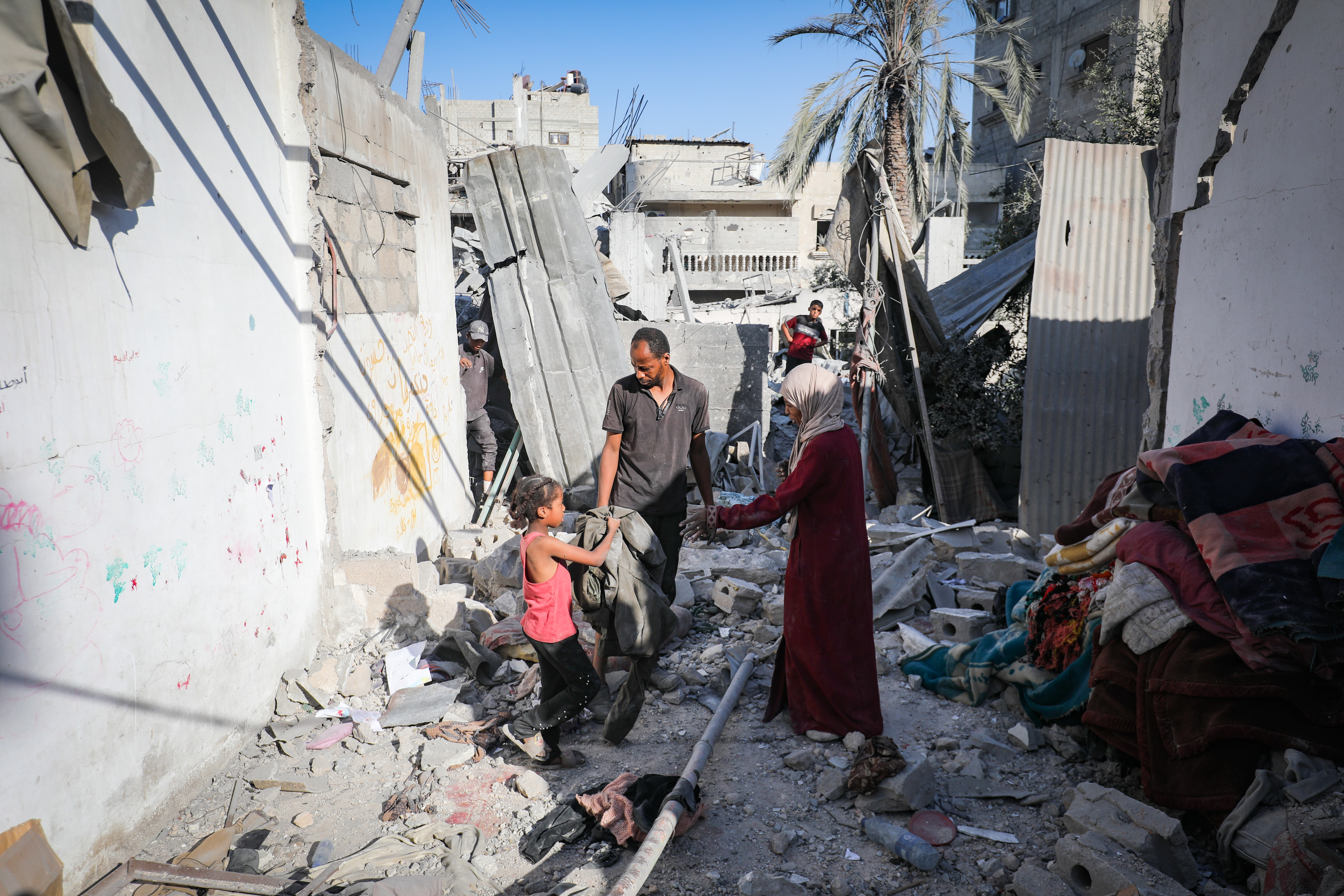 Palestinians at the Bureij Refugee Camp in the central Gaza Strip, on August 26, 2025. 