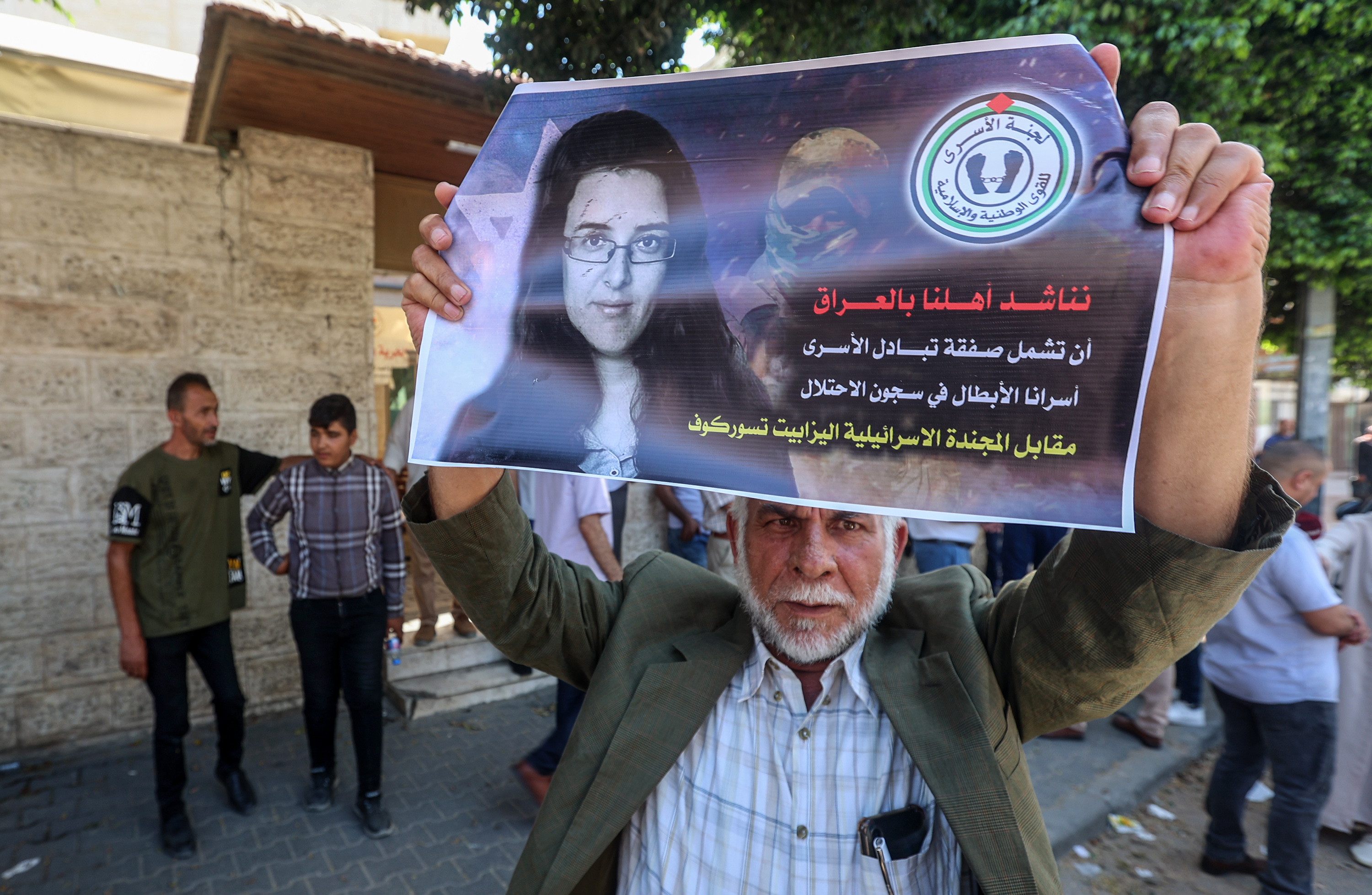 Palestinians raise pictures of Israeli-Russian researcher Elizabeth Tsurkov, who was kidnapped in Iraq, during a demonstration demanding not to release her, in front of the International Red Cross, in Gaza City, on July 17, 2023. 