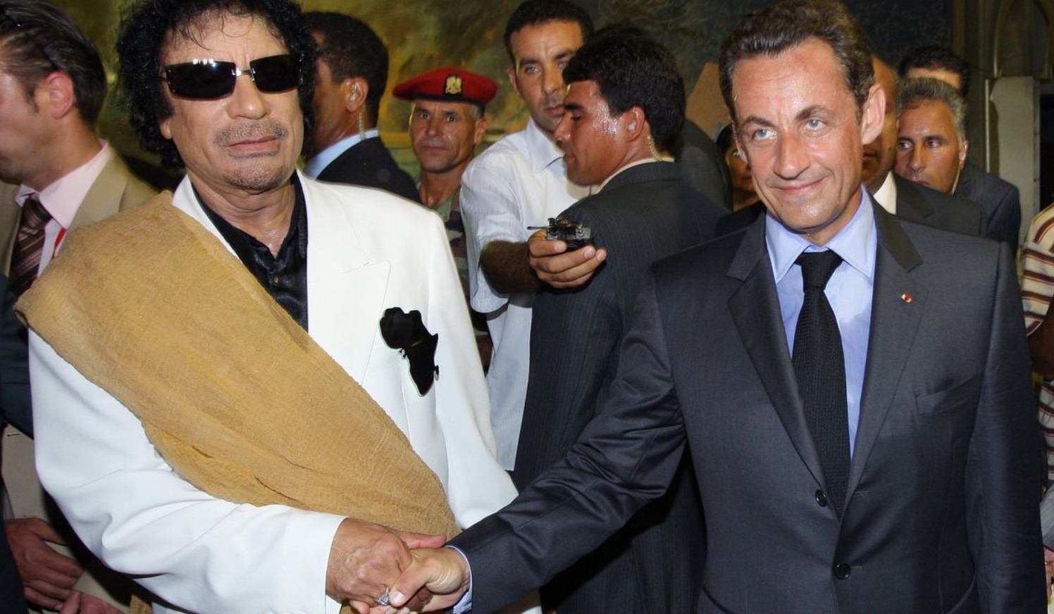 Nicolas Sarkozy and Muammar Gaddafi