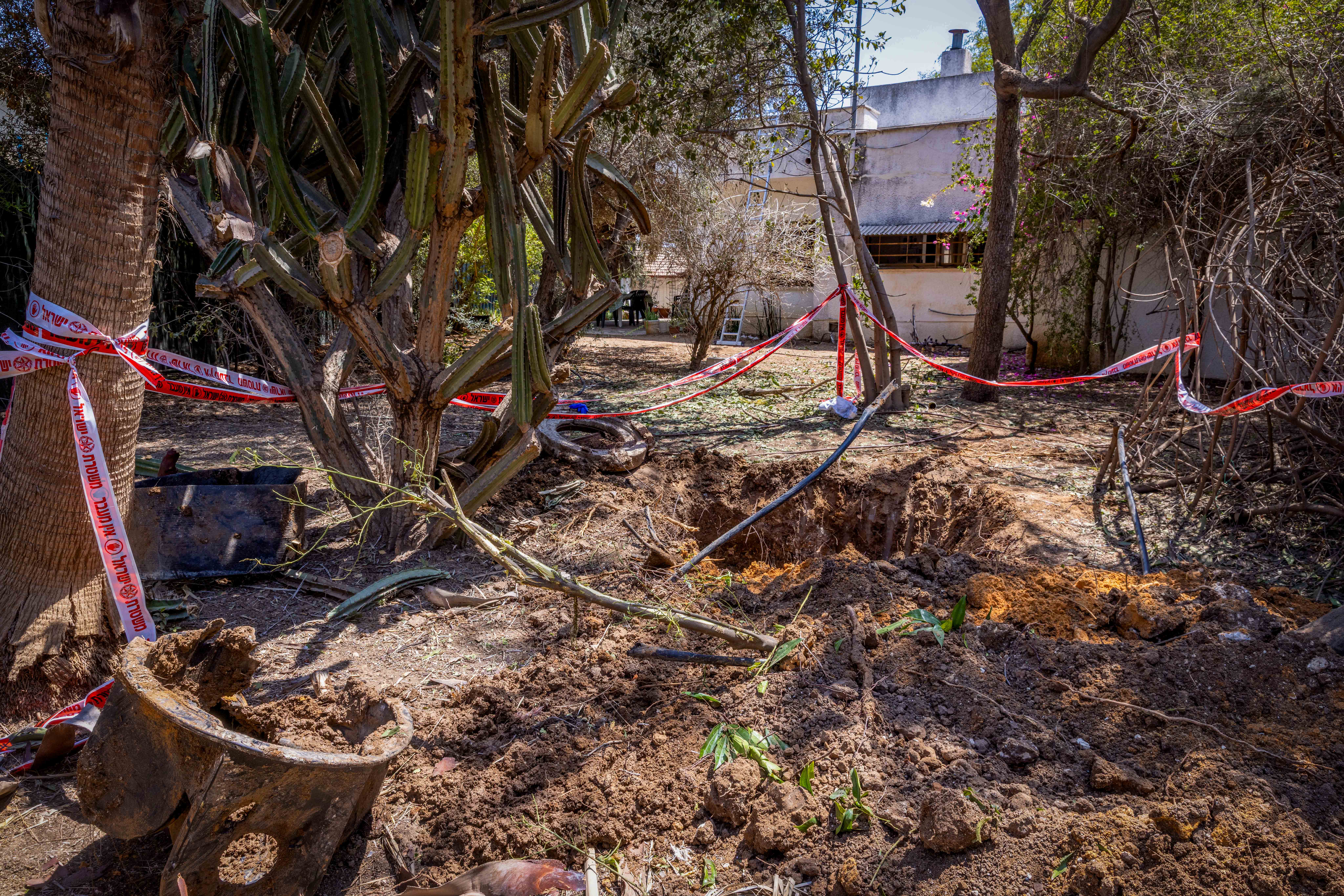 The scene where fragments of a ballistic missile fired from Yemen hit an open area in Moshav Ginaton, central Israel, August 23, 2025.