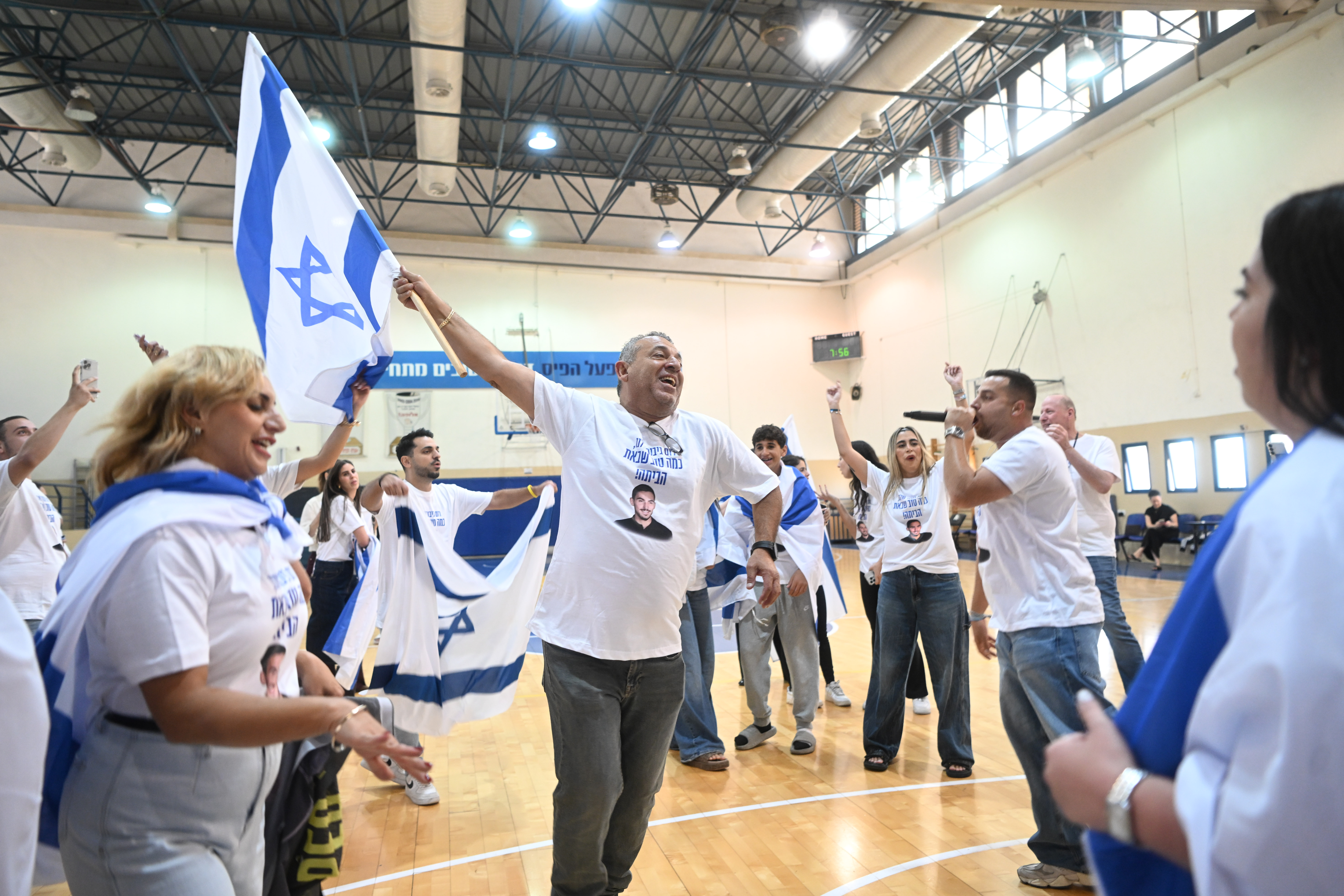 Family and friends of Israeli hostage Rom Braslavski watch his release from Hamas captivity in Jerusalem, October 13, 2025. 