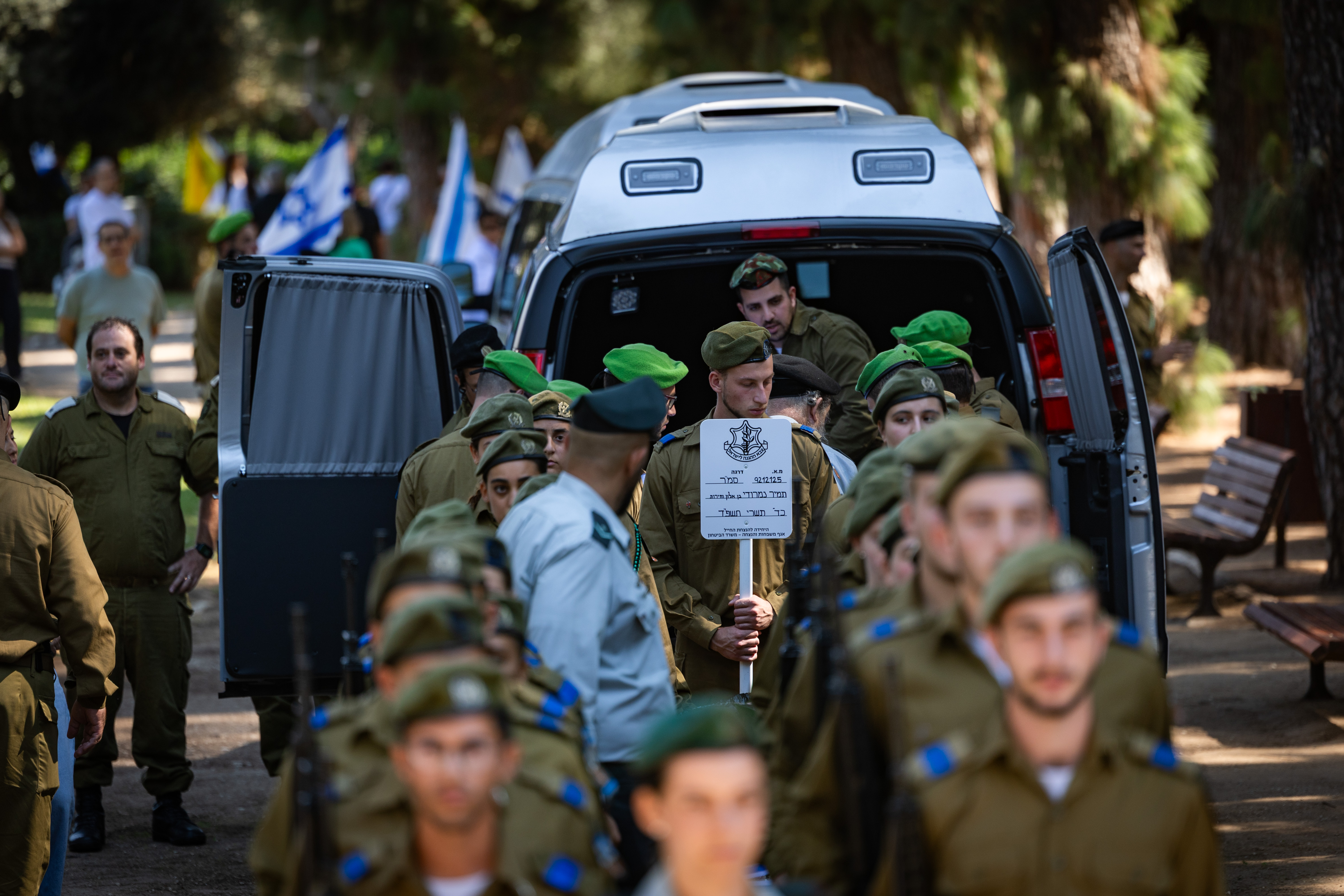 Family and friends of slain hostage Staff sergeant Tamir Nimrodi attend his funeral at Kfar Saba Military Cemetery on October 16, 2025