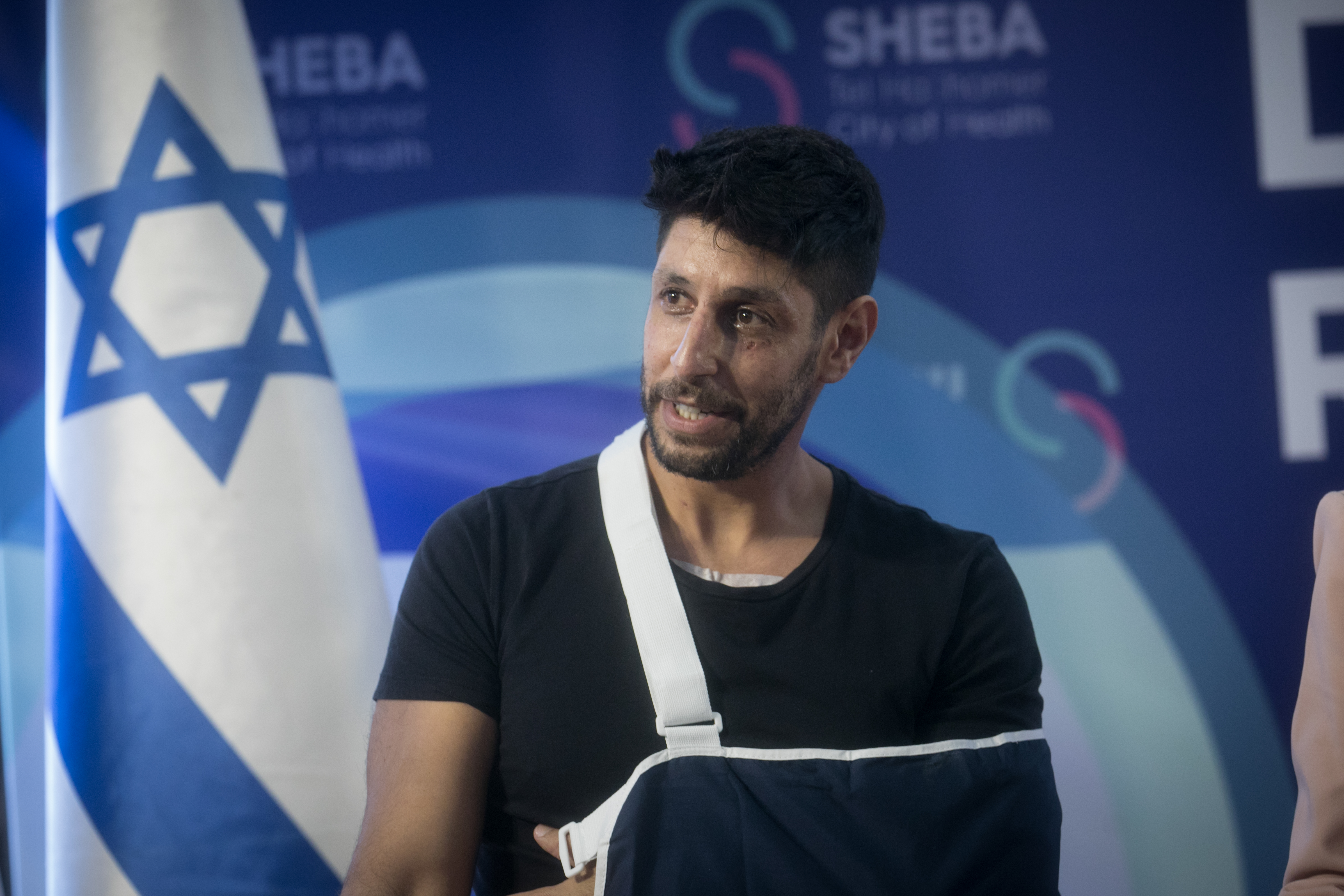 Israeli singer-songwriter and reserve soldier Idan Amedi who was seriously injured in the Gaza Strip attends a press conference upon his release from the Sheba Medical center on January 25, 2024.