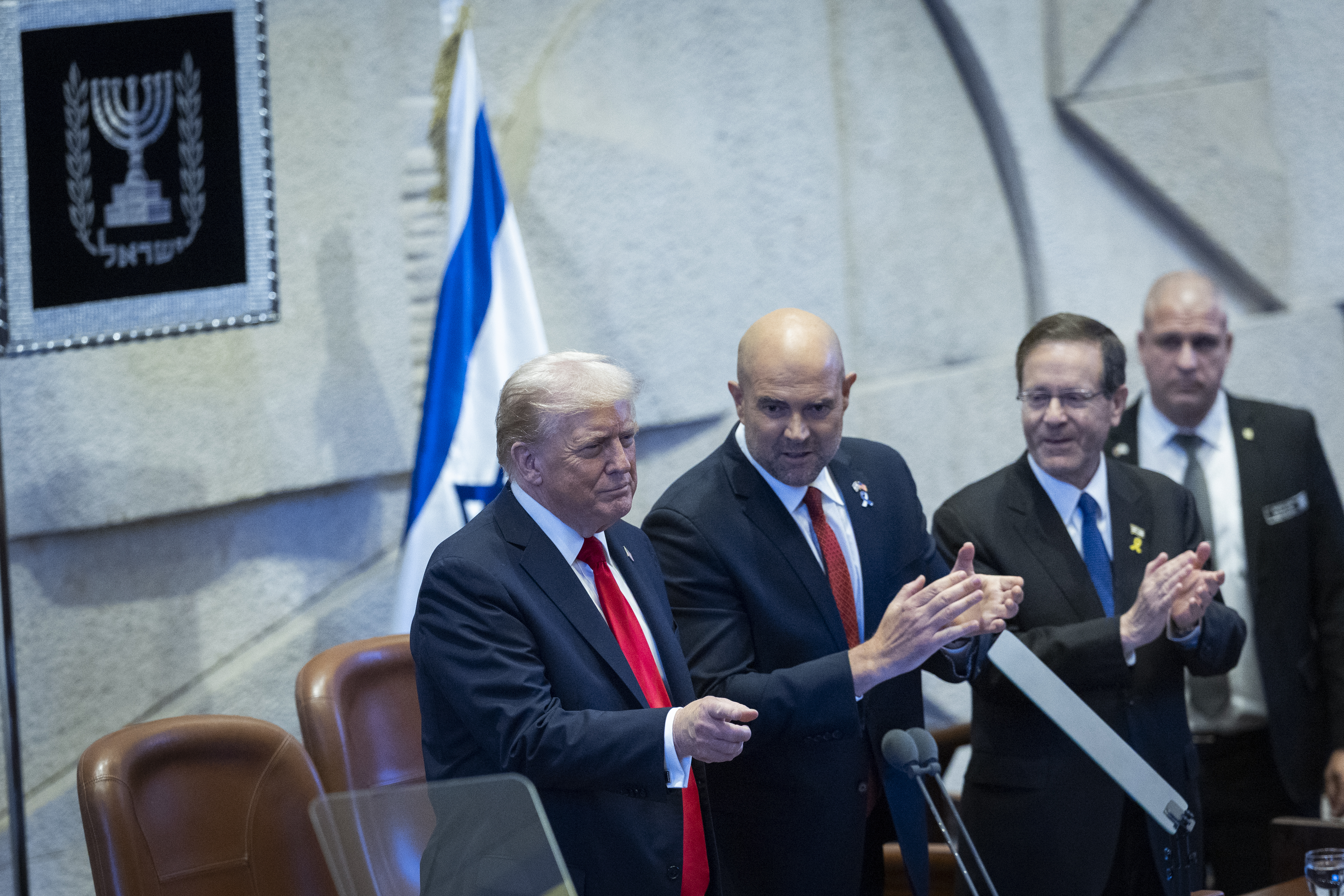 U.S. President Donald Trump, Israeli President Isaac Herzog and Knesset speaker Amir Ohana arrive for a special plenum session in honor of President Trump at the Knesset, Israel’s parliament in Jerusalem, on October 13, 2025.