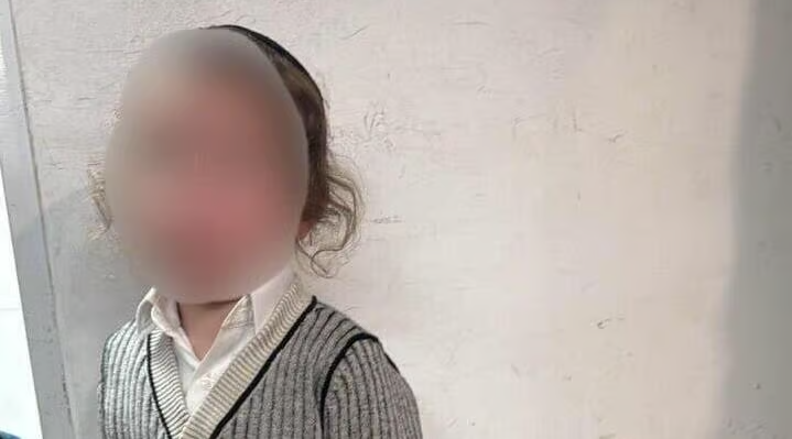 The boy who was found alone in Qalandiya.